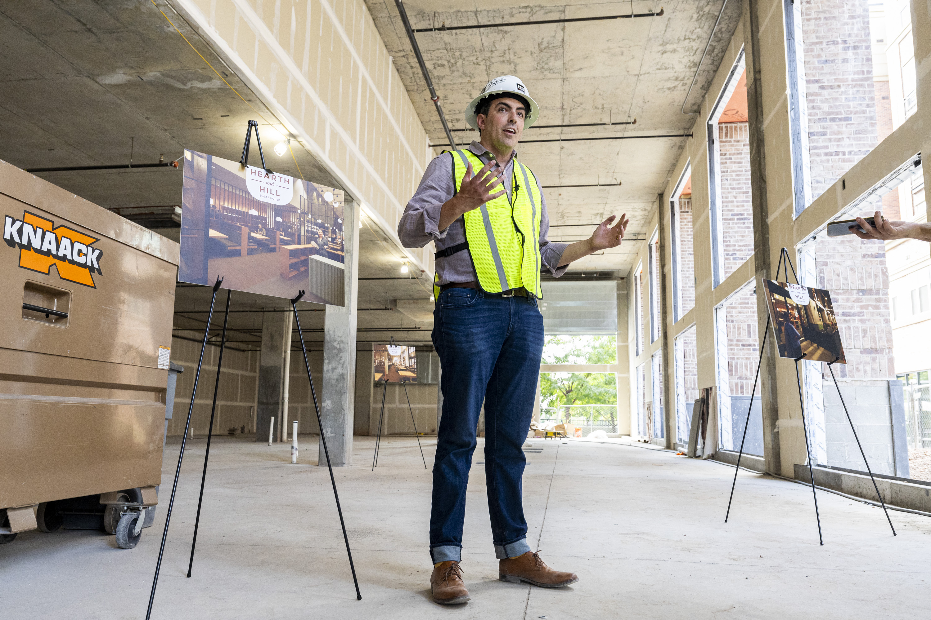 Brooks Kirchheimer, co-founder of Leave Room For Dessert Eateries, talks with members of the media after a groundbreaking ceremony held by Leave Room For Dessert Eateries at the future site of Hearth and Hill and also Hill’s Kitchen in Salt Lake City on Thursday.