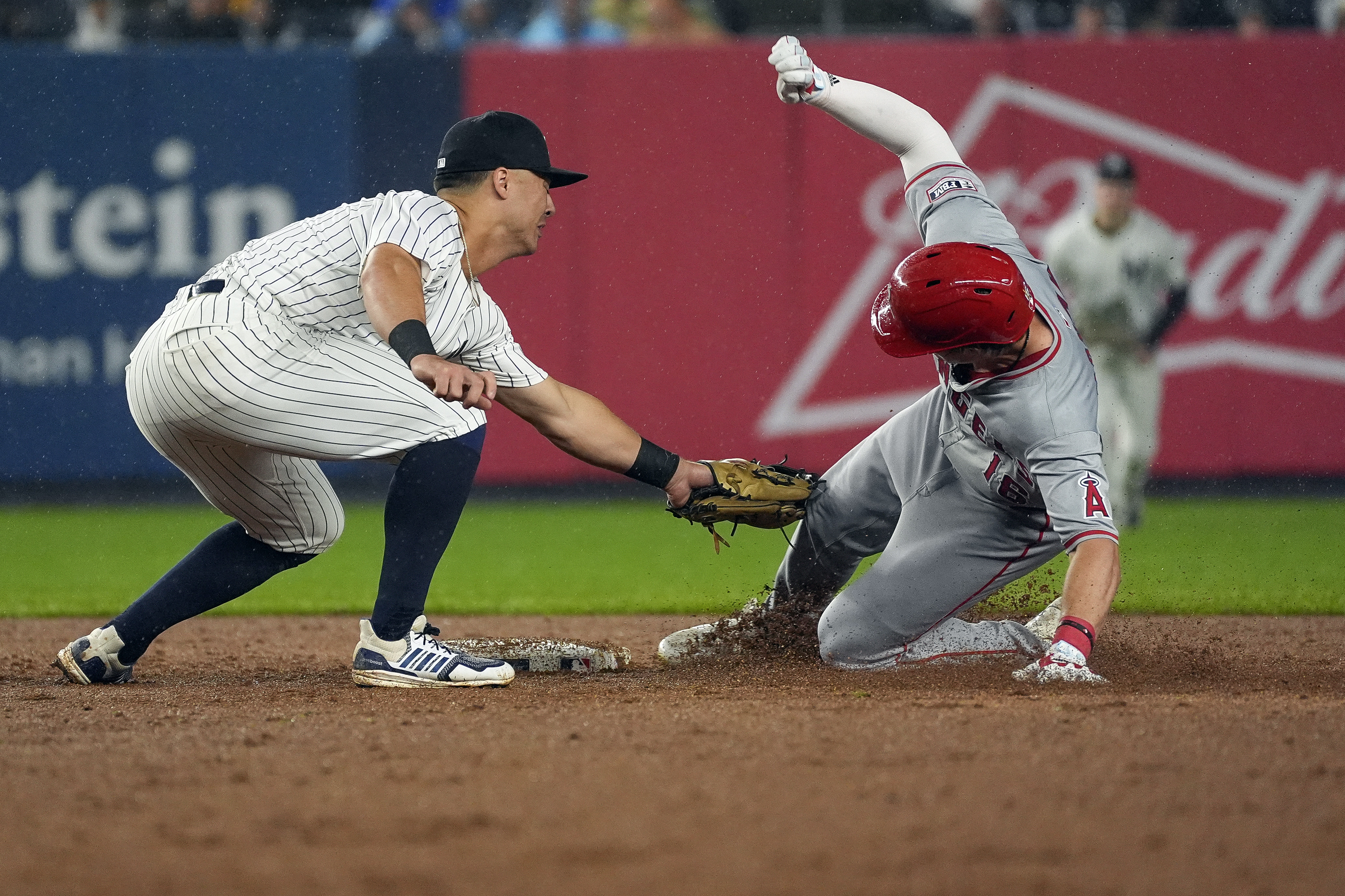 New York Yankees shortstop Anthony Volpe tags out Los Angeles Angels' Mickey Moniak trying to stretch a single into a double during the fifth inning of a baseball game, Thursday, Aug. 8, 2024, in New York. 