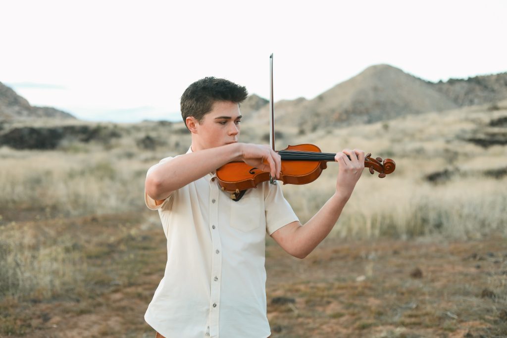 Violinist Emmett Riding raised funds to bring a famous violinist to St. George for a public concert and to mentor other teen musicians, location and date not specified.