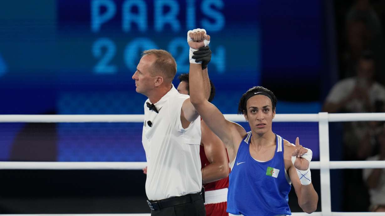 Algeria's Imane Khelif gestures after defeating Thailand's Janjaem Suwannapheng in their women's 66 kg semifinal boxing match at the 2024 Summer Olympics, Tuesday, Aug. 6, 2024, in Paris, France.