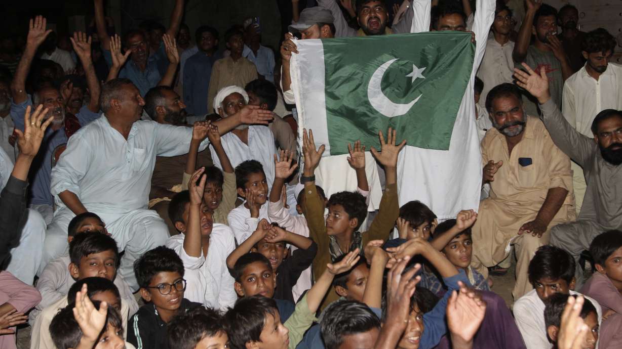 People celebrate Pakistani Arshad Nadeem's javelin throw gold medal at the 2024 Summer Olympics, in Khanewal District of Punjab province, Pakistan, Thursday, Aug. 8, 2024.