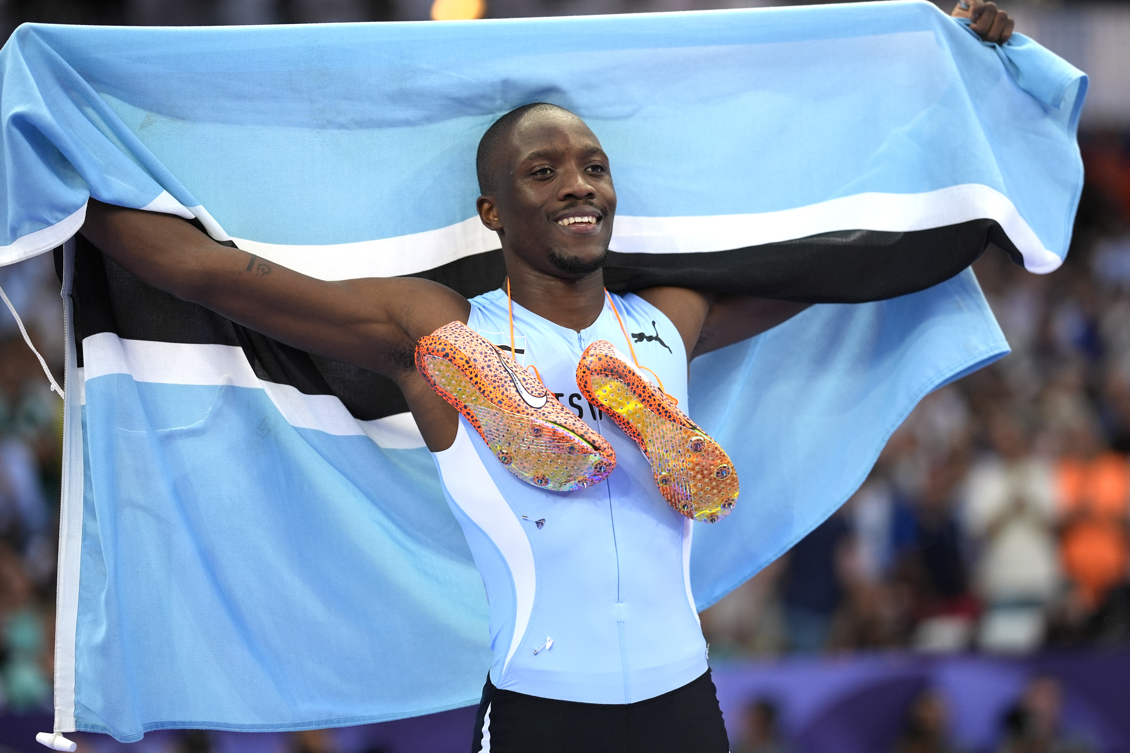 Letsile Tebogo, of Botswana, celebrates after winning the men's 200-meter final at the 2024 Summer Olympics, Thursday, Aug. 8, 2024, in Saint-Denis, France. 