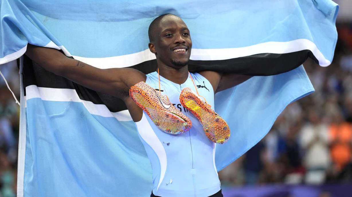 Letsile Tebogo, of Botswana, celebrates after winning the men's 200-meter final at the 2024 Summer Olympics, Thursday, Aug. 8, 2024, in Saint-Denis, France.