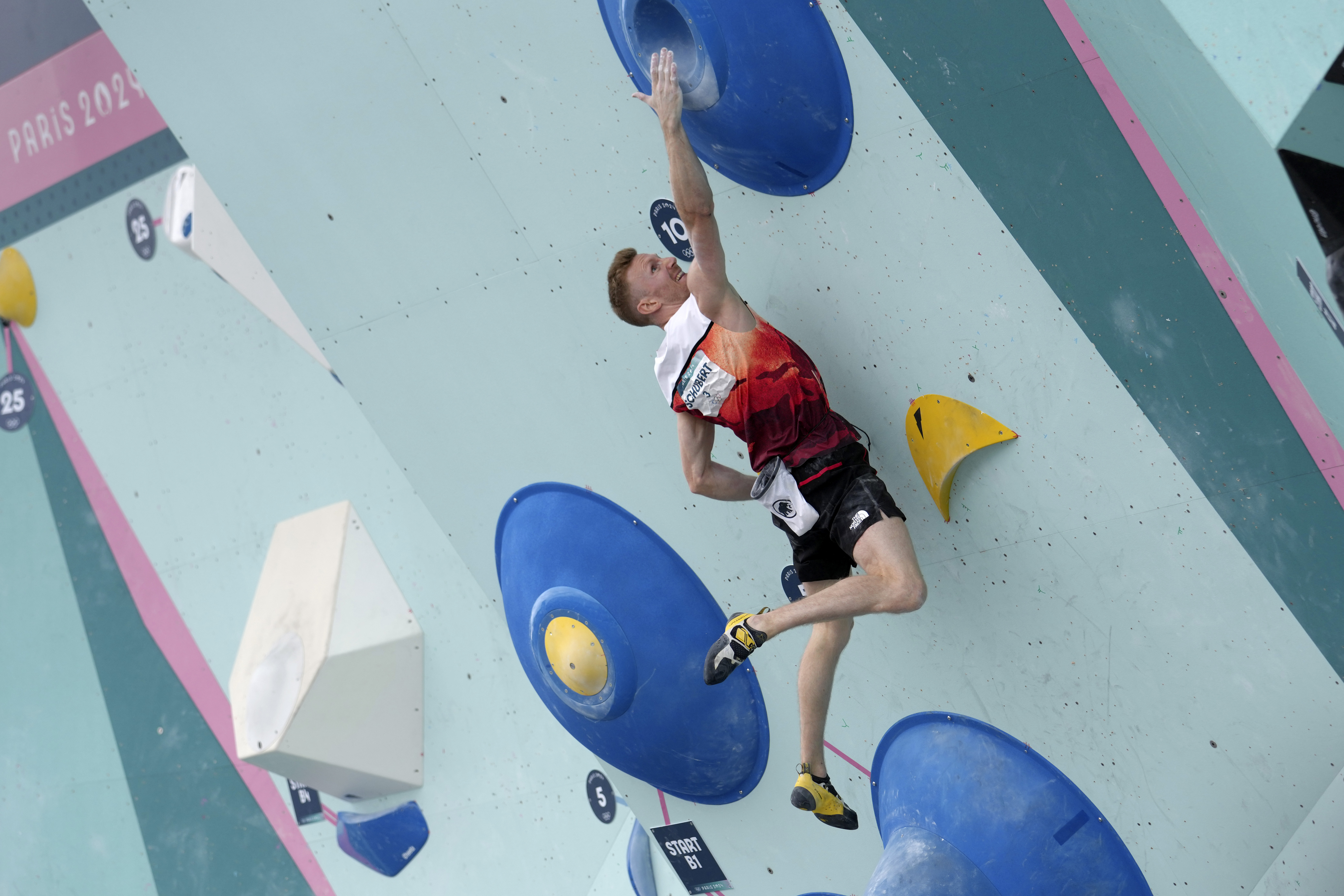 Jakob Schubert of Austria competes in the men's boulder and lead, boulder final, during the sport climbing competition at the 2024 Summer Olympics, Friday, Aug. 9, 2024, in Le Bourget, France. 