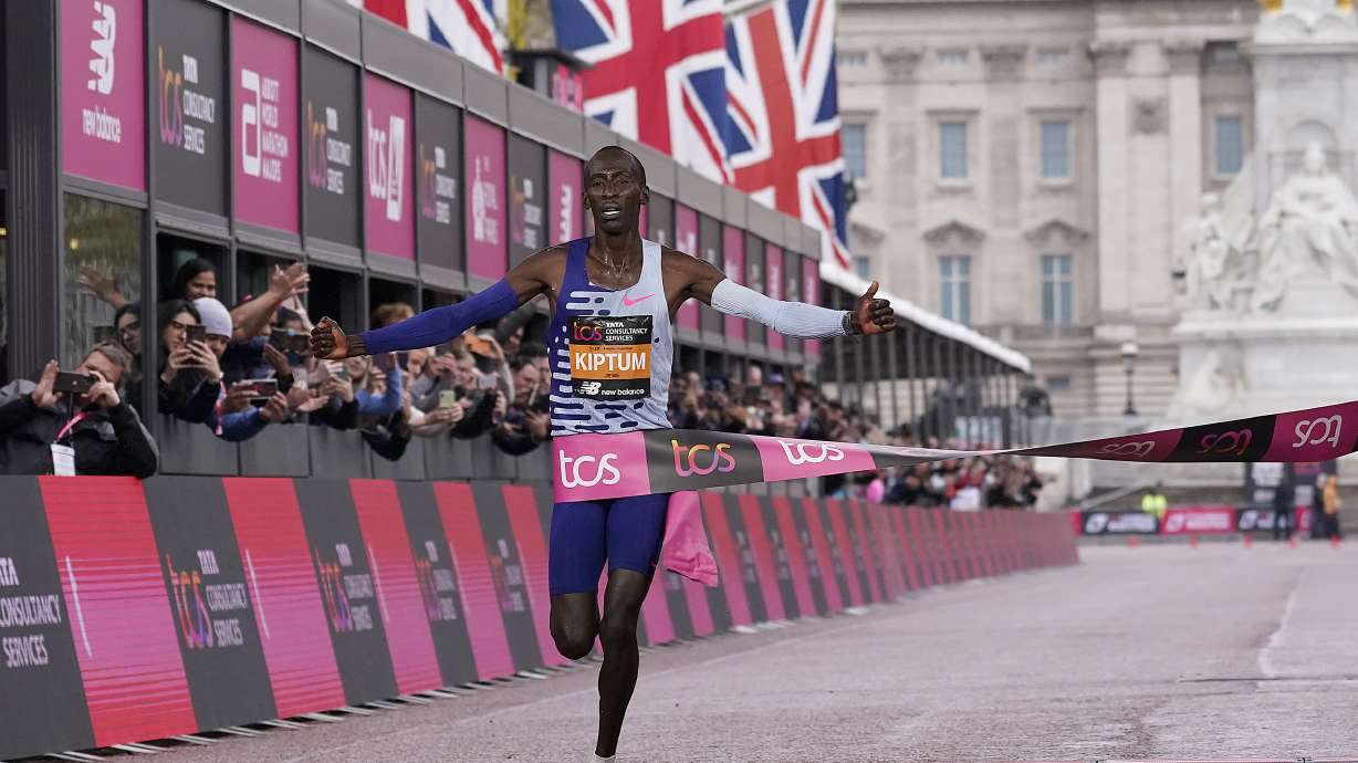 FILE - Kenya's Kelvin Kiptum crosses the finish line to win the men's race at the London Marathon in London, Sunday, April 23, 2023.