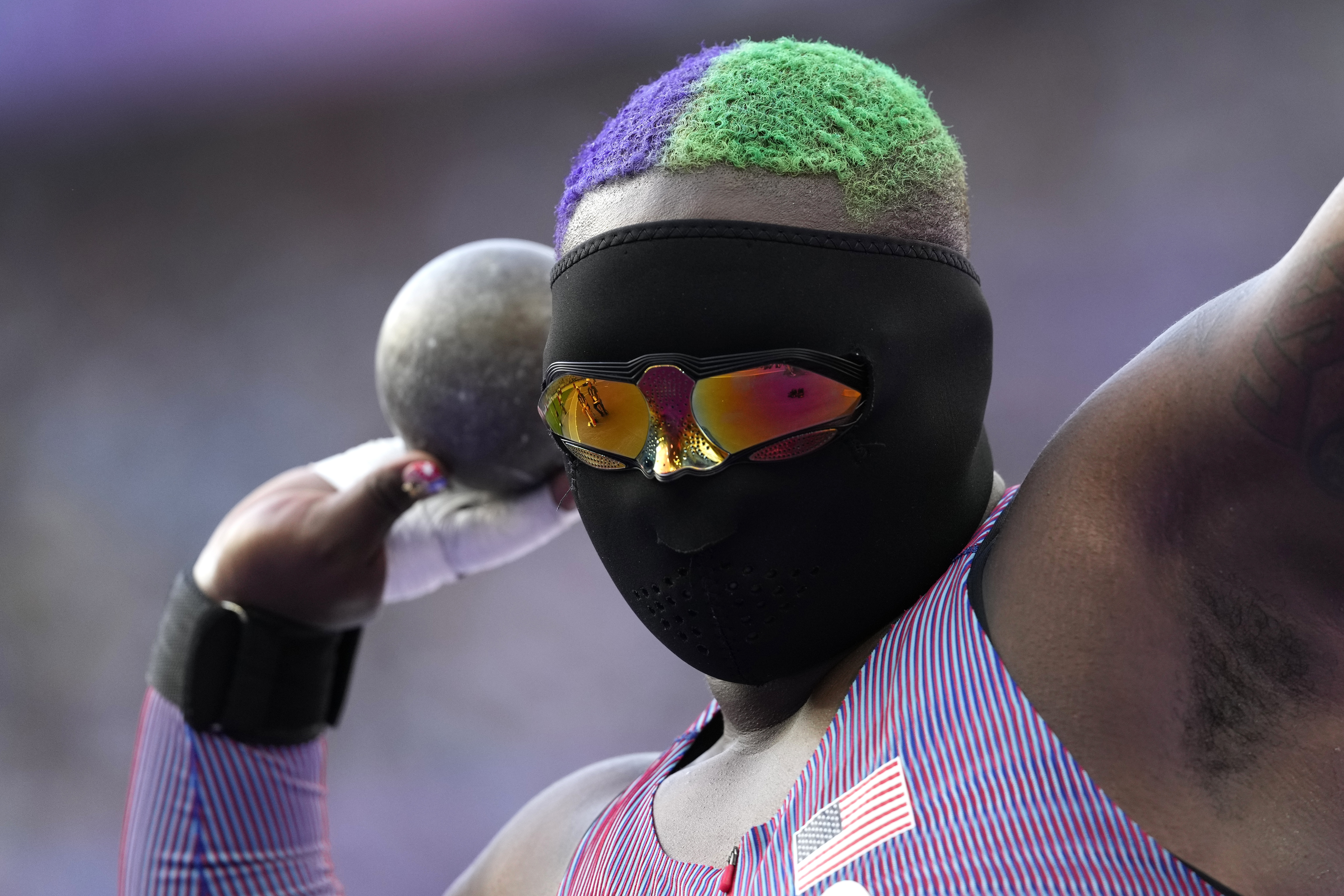 Raven Saunders, of the United States, competes during the women's shot put qualification at the 2024 Summer Olympics, Thursday, Aug. 8, 2024, in Saint-Denis, France. 