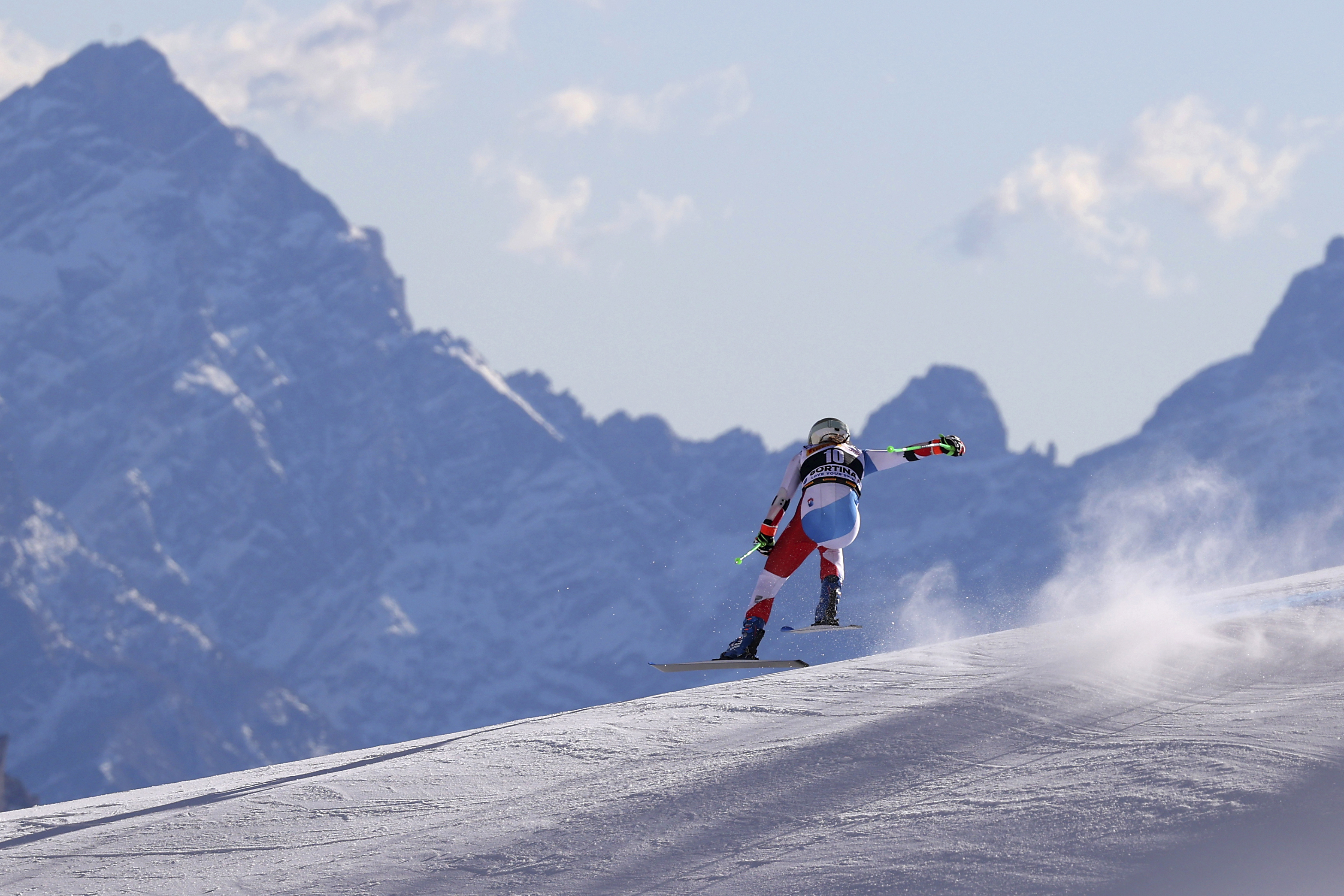 FILE - Switzerland's Priska Nufer speeds down the course during an alpine ski, women's World Cup downhill training, in Cortina d'Ampezzo, Italy, Friday, Jan. 21, 2022. 