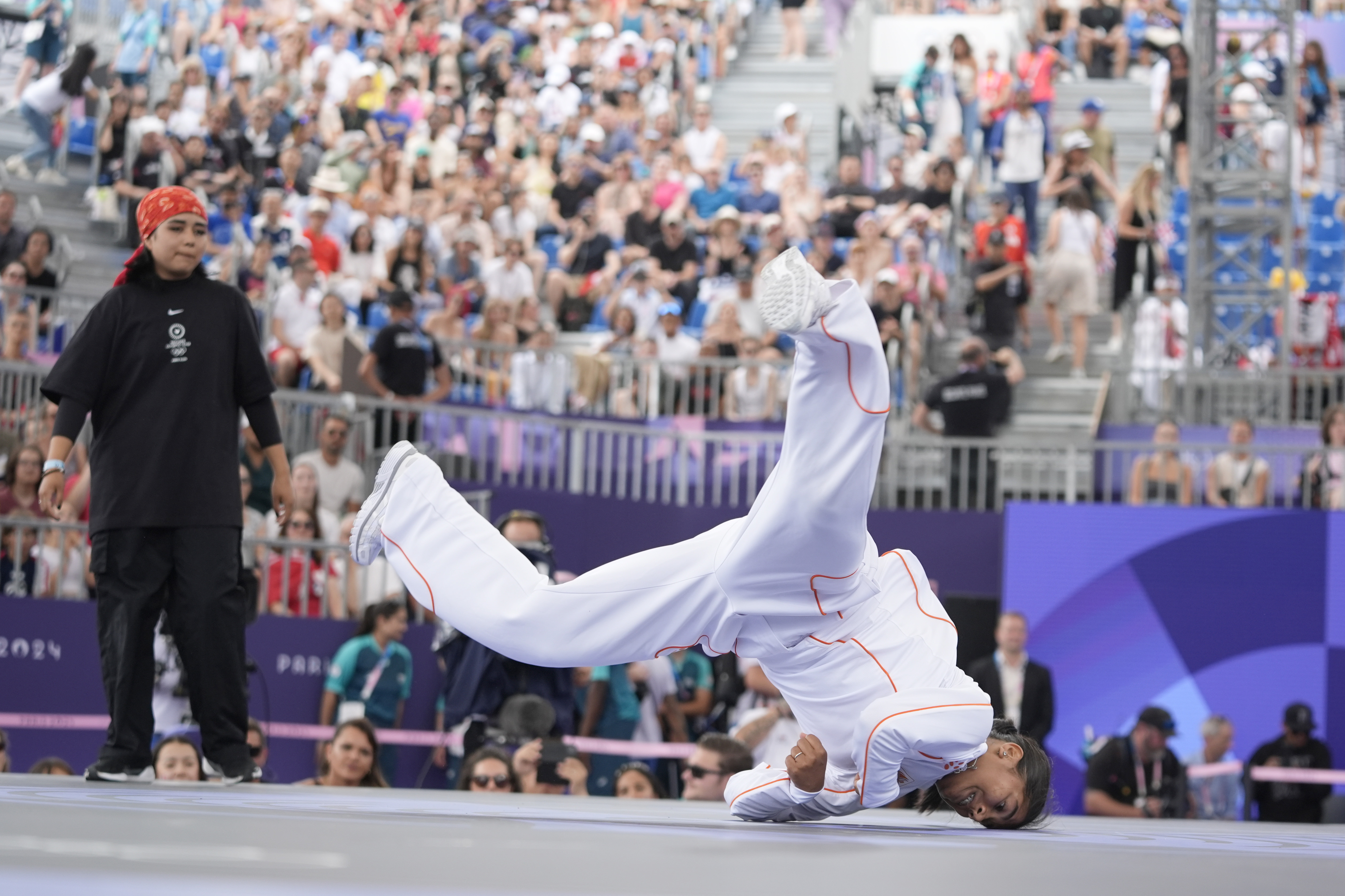 Netherland's India Sardjoe, known as B-Girl India, right, competes during the B-Girls Pre-Qualifier Battle of the breaking competition at La Concorde Urban Park at the 2024 Summer Olympics, Friday, Aug. 9, 2024, in Paris, France. 