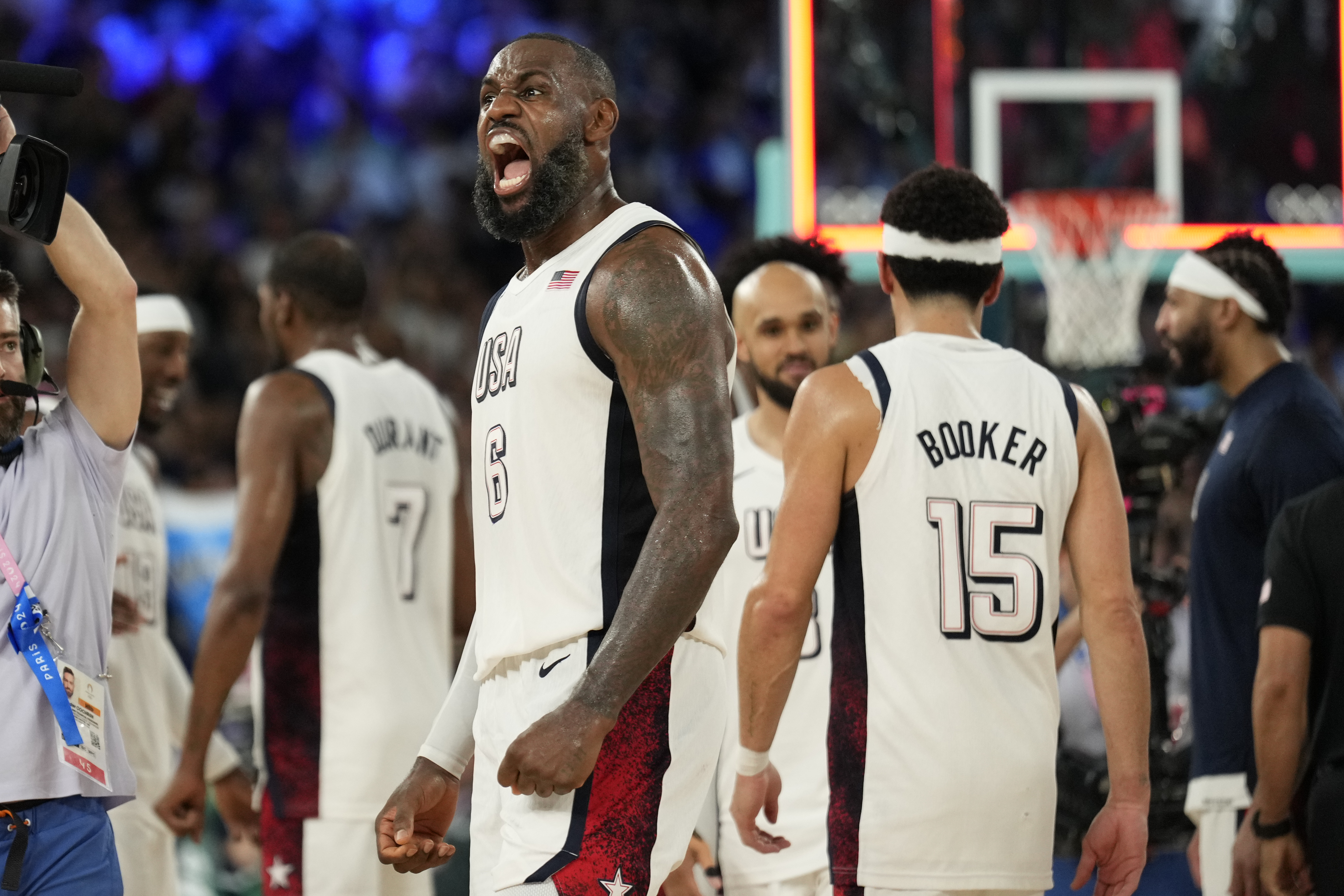 United States' LeBron James (6) celebrates after beating Serbia during a men's semifinals basketball game at Bercy Arena at the 2024 Summer Olympics, Thursday, Aug. 8, 2024, in Paris, France. 