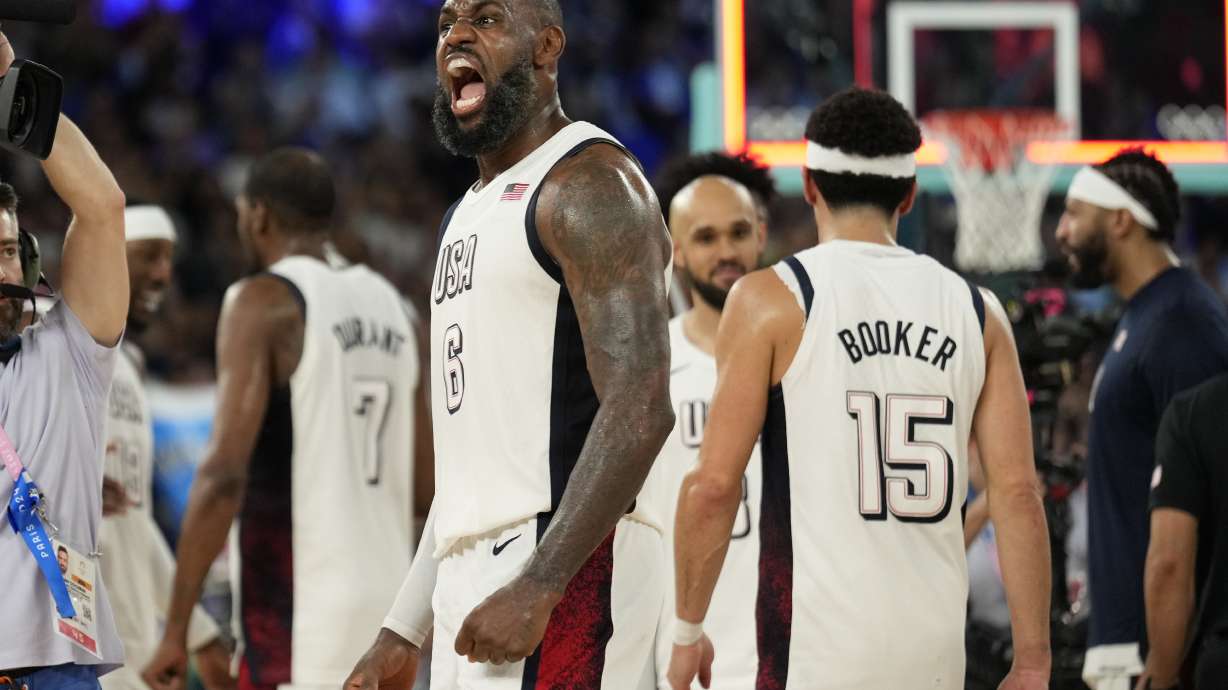 United States' LeBron James (6) celebrates after beating Serbia during a men's semifinals basketball game at Bercy Arena at the 2024 Summer Olympics, Thursday, Aug. 8, 2024, in Paris, France.