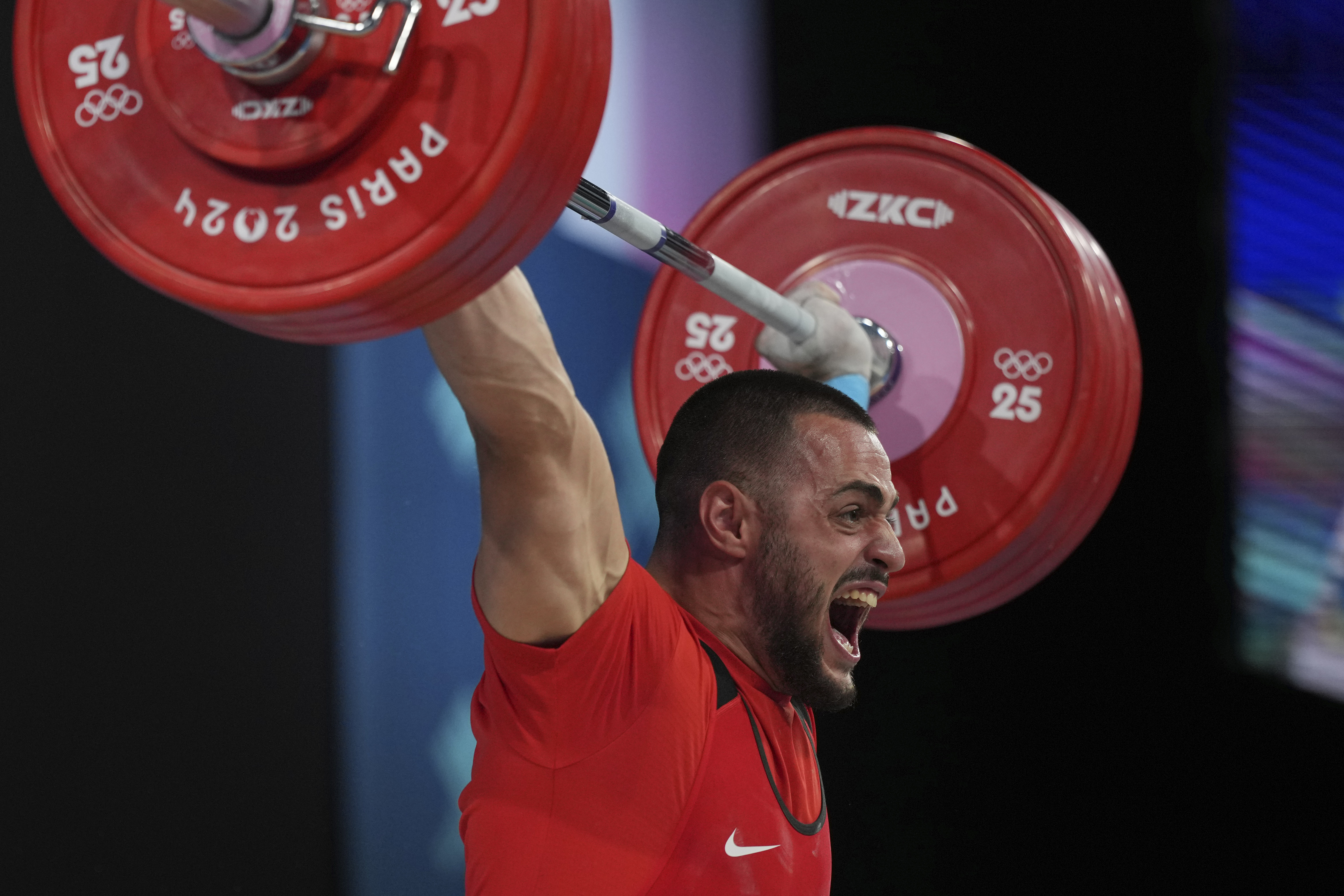 Karlos May Nasar of Bulgaria competes during the men's 89kg weightlifting event, at the 2024 Summer Olympics, Friday, Aug. 9, 2024, in Paris, France.