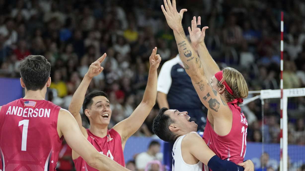 Players of the United States celebrate after scoring a point during the men's bronze medal volleyball match between the United States and Italy at the 2024 Summer Olympics, Friday, Aug. 9, 2024, in Paris, France.