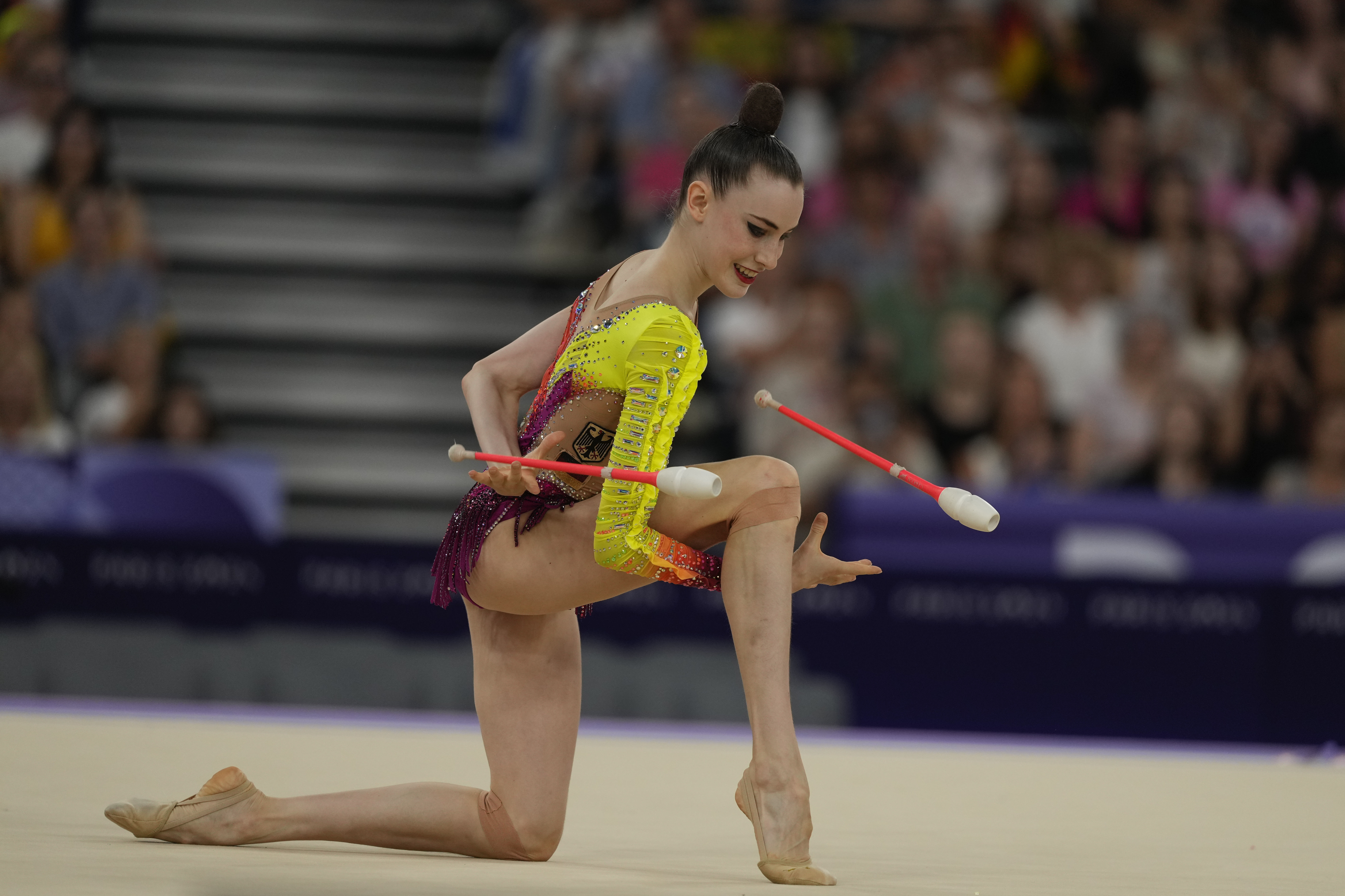 Varfolomeev Darja, of Germany, performs clubs exercise in the rhythmic gymnastics individuals all-round final at La Chapelle Arena at the 2024 Summer Olympics, Friday, Aug. 9, 2024, in Paris, France.