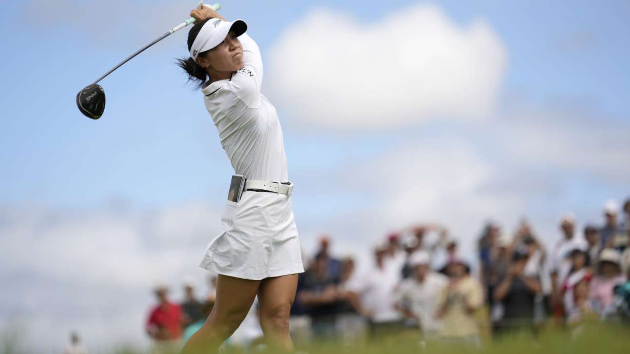 Lydia Ko, of New Zealand, hits her shot from the 12th tee during the third round of the women's golf event at the 2024 Summer Olympics, Friday, Aug. 9, 2024, at Le Golf National, in Saint-Quentin-en-Yvelines, France.