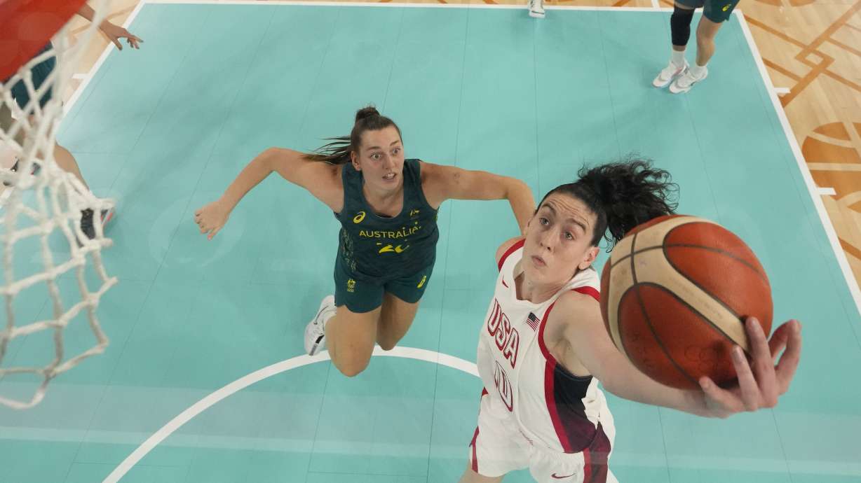 United States' Breanna Stewart (10) shoots past Isobel Borlase (20), of Australia, during a women's semifinal basketball game at Bercy Arena at the 2024 Summer Olympics, Friday, Aug. 9, 2024, in Paris, France.