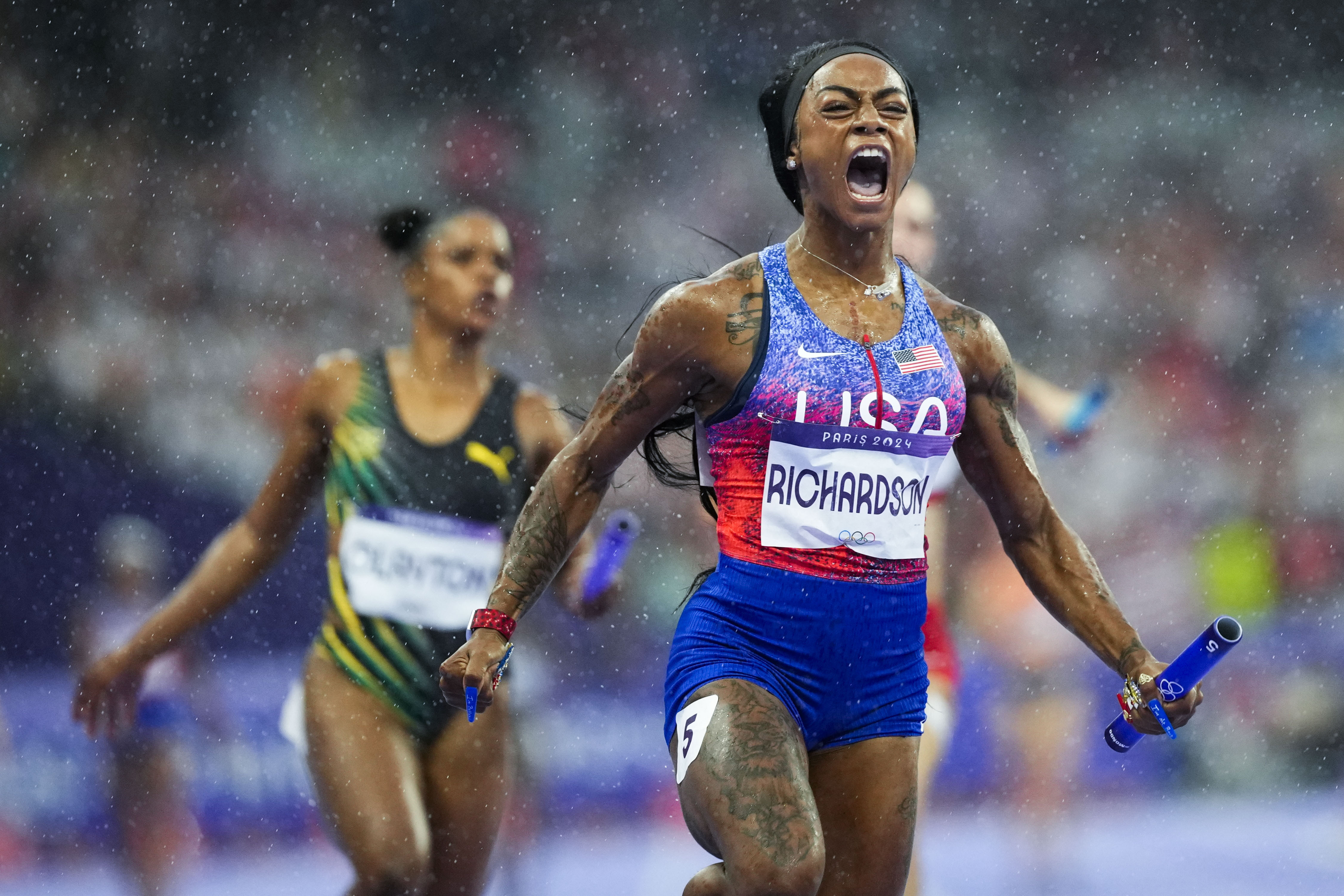 Sha'carri Richardson 0f the United States, celebrates after winning the women's 4 x 400-meter relay final at the 2024 Summer Olympics, Friday, Aug. 9, 2024, in Saint-Denis, France. 