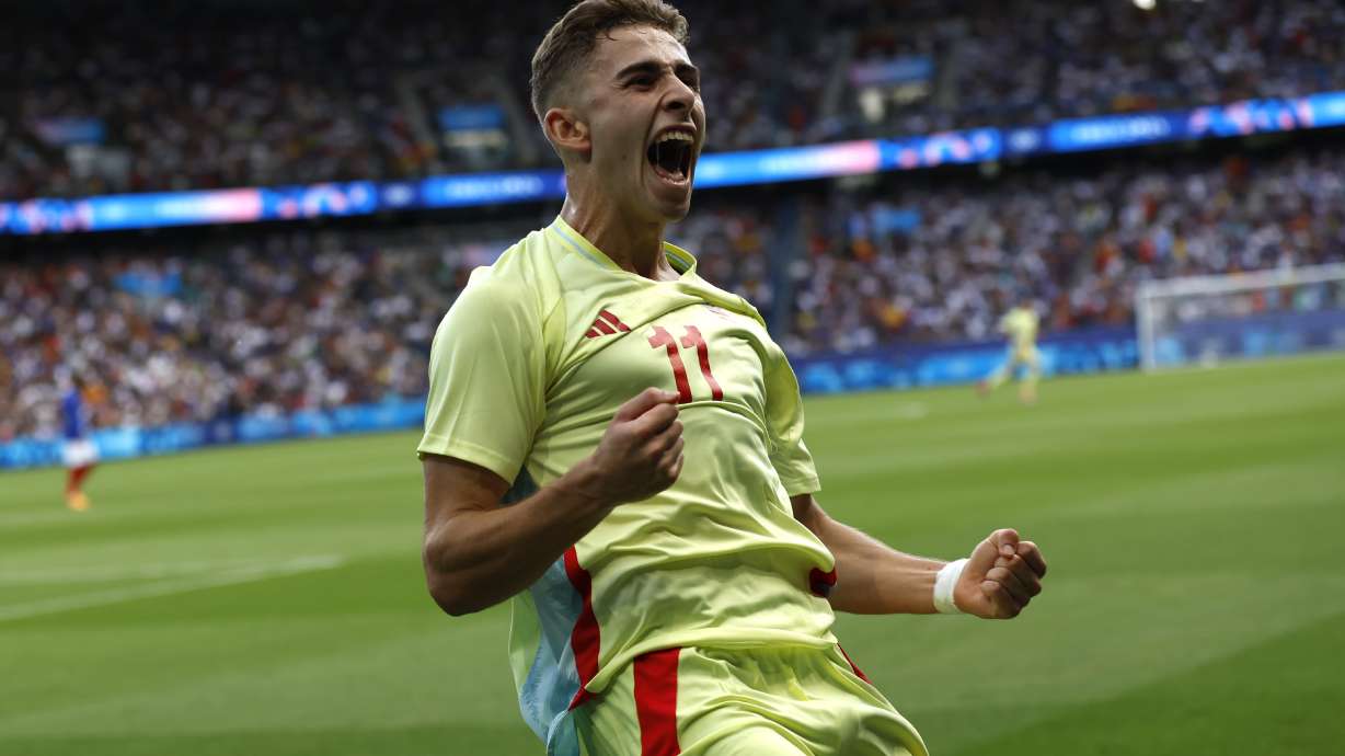 Spain's Fermin Lopez celebrates after scoring his goal during the men's soccer gold medal match between France and Spain at the Parc des Princes during the 2024 Summer Olympics, Friday, Aug. 9, 2024, in Paris, France.