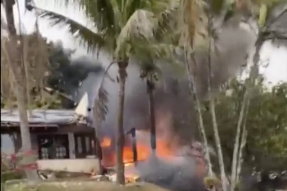 This frame grab from UGC video provided by Felipe Magalhaes Filho shows fire coming from a plane that crashed by a home in Vinhedo, Sao Paulo state, Brazil, Friday.