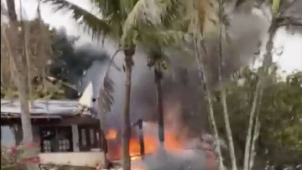 This frame grab from UGC video provided by Felipe Magalhaes Filho shows fire coming from a plane that crashed by a home in Vinhedo, Sao Paulo state, Brazil, Friday.