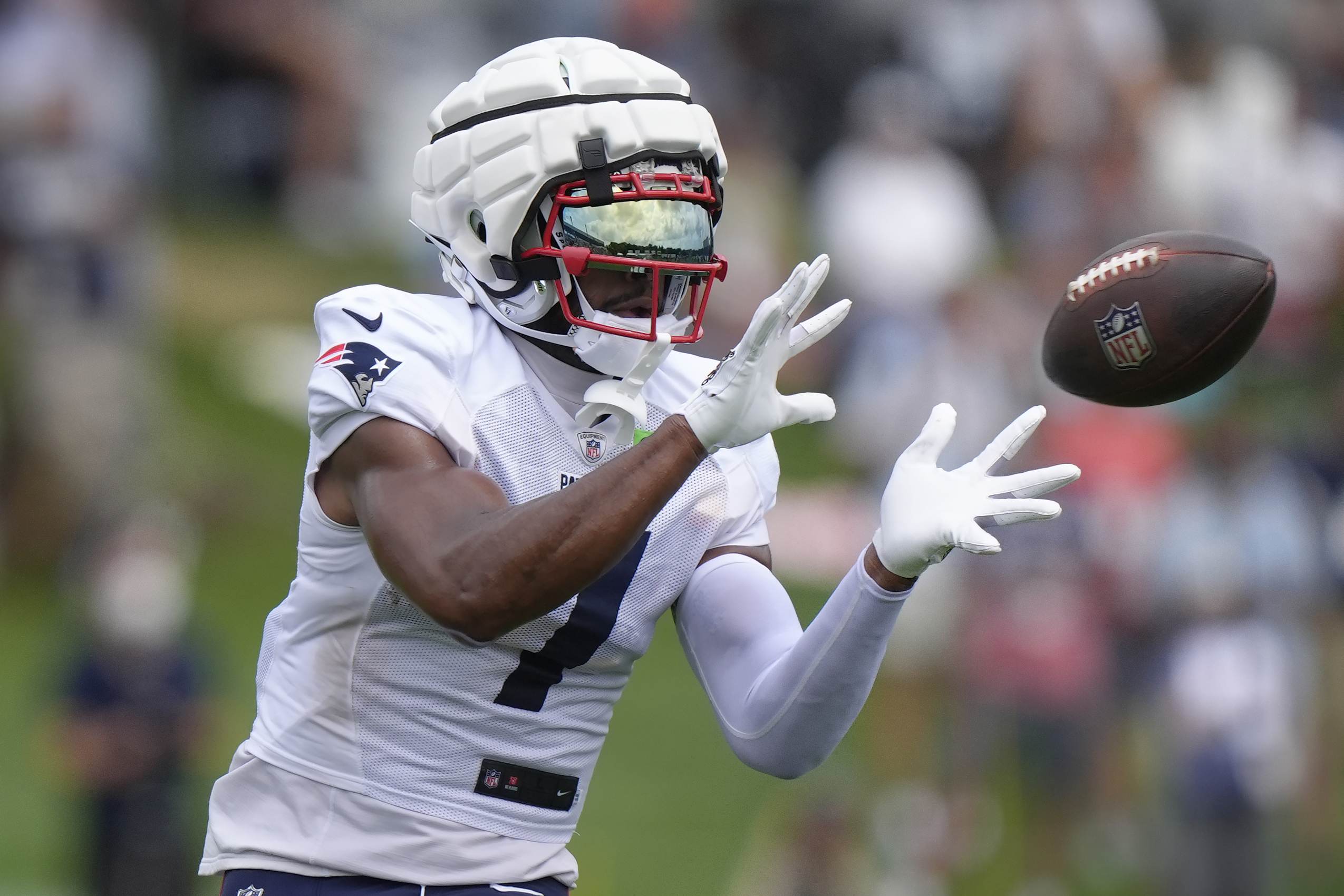 New England Patriots wide receiver JuJu Smith-Schuster makes a catch during NFL football training camp, Tuesday, July 30, 2024, in Foxborough, Mass. 