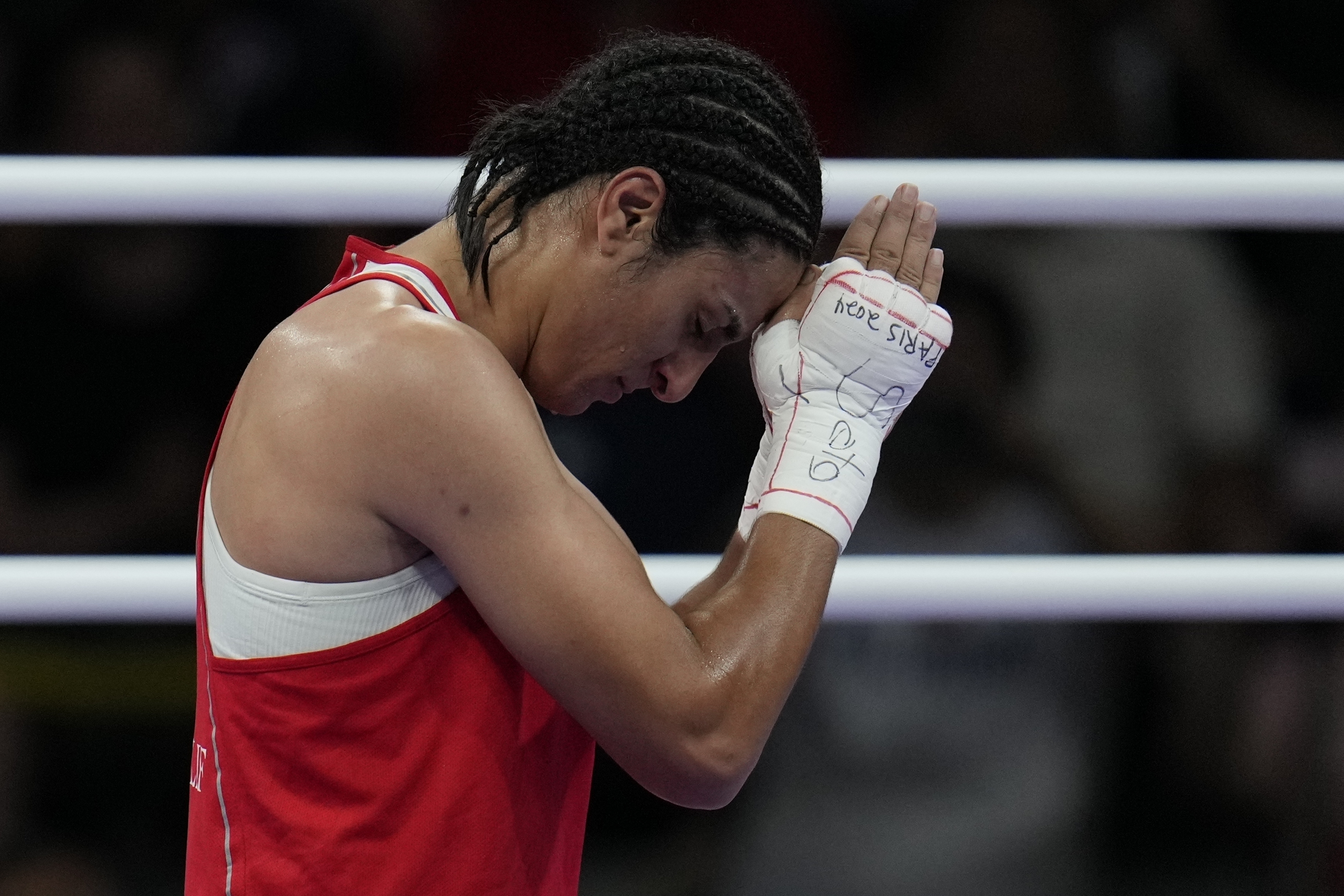 Algeria's Imane Khelif, celebrates after defeating Hungary's Anna Hamori in their women's 66kg quarterfinal boxing match at the 2024 Summer Olympics, Saturday, Aug. 3, 2024, in Paris, France.