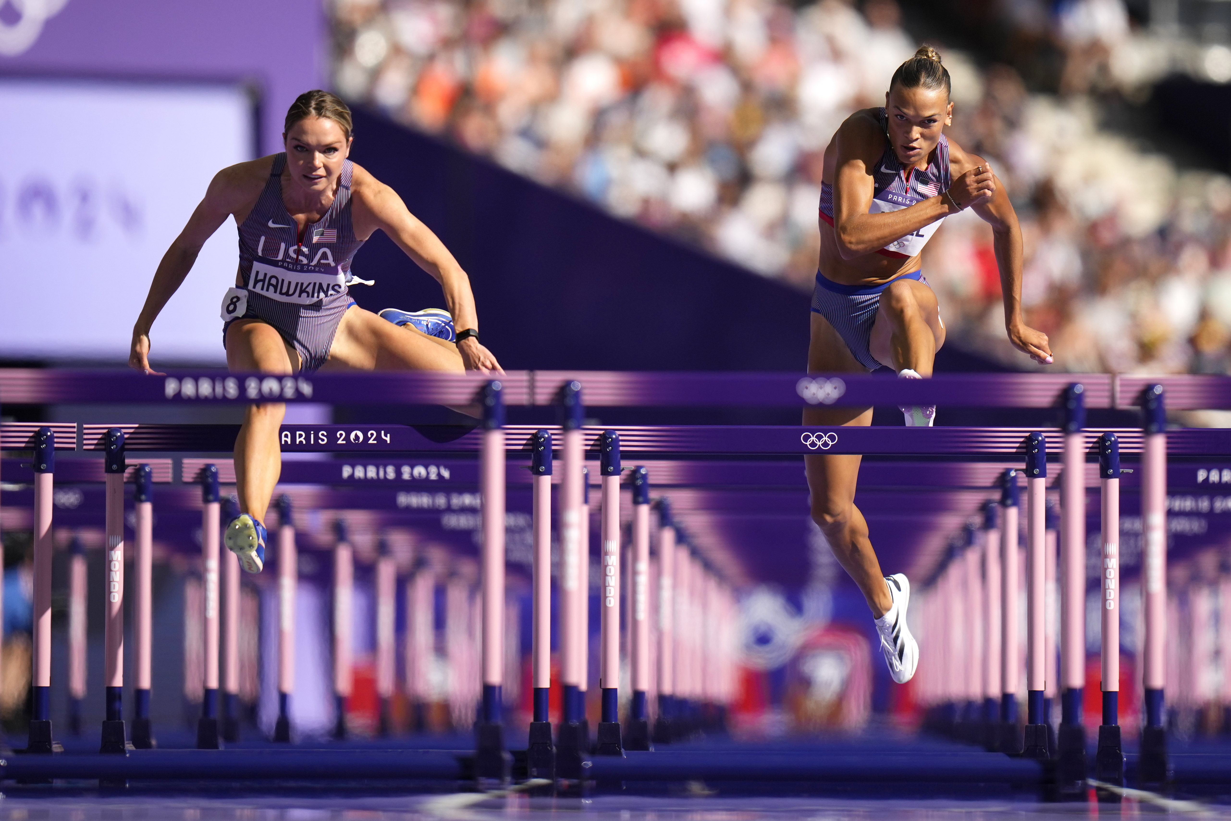 Anna Hall, right, of the United States, and Chari Hawkins on the United States, compete in the women's heptathlon 100-meter hurdles at the 2024 Summer Olympics, Thursday, Aug. 8, 2024, in Saint-Denis, France.