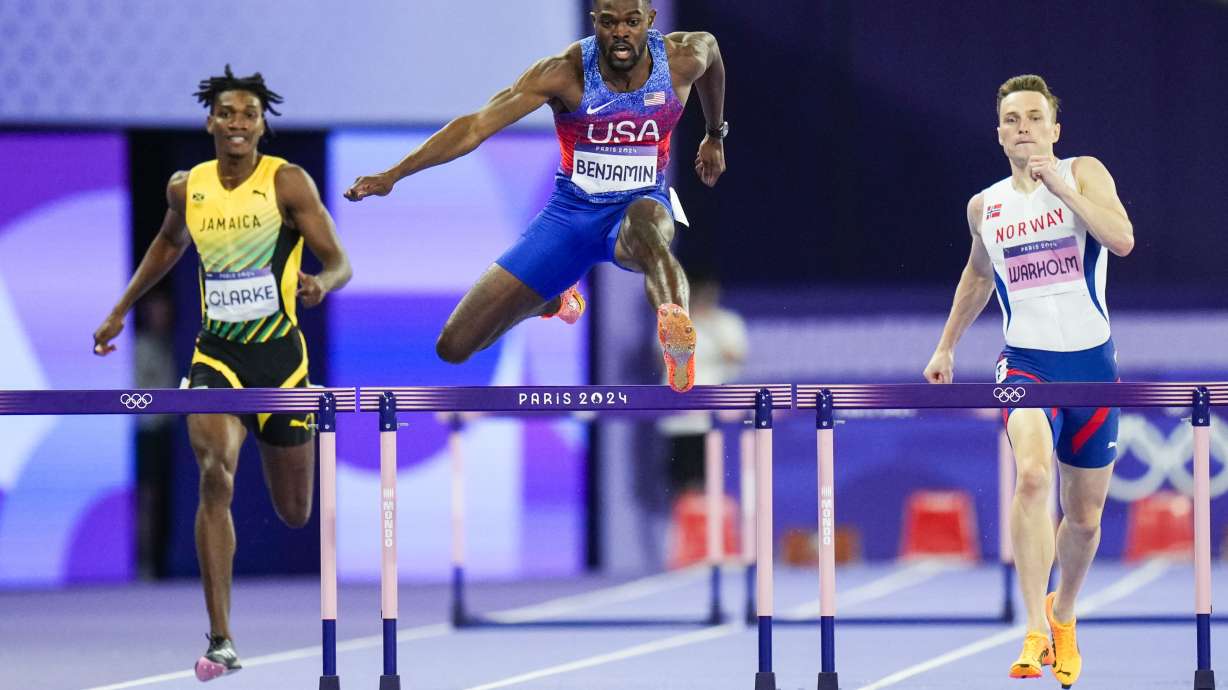 Rai Benjamin, of the United States, competes during the men's 400-meter hurdles final at the 2024 Summer Olympics, Friday, Aug. 9, 2024, in Saint-Denis, France.