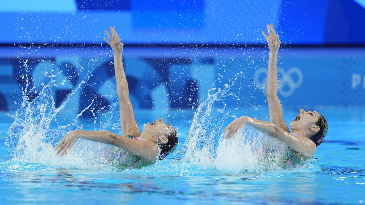 China's Wang Liuyi and Wang Qianyi compete in the duet technical routine of artistic swimming at the 2024 Summer Olympics, Friday, Aug. 9, 2024, in Saint-Denis, France.