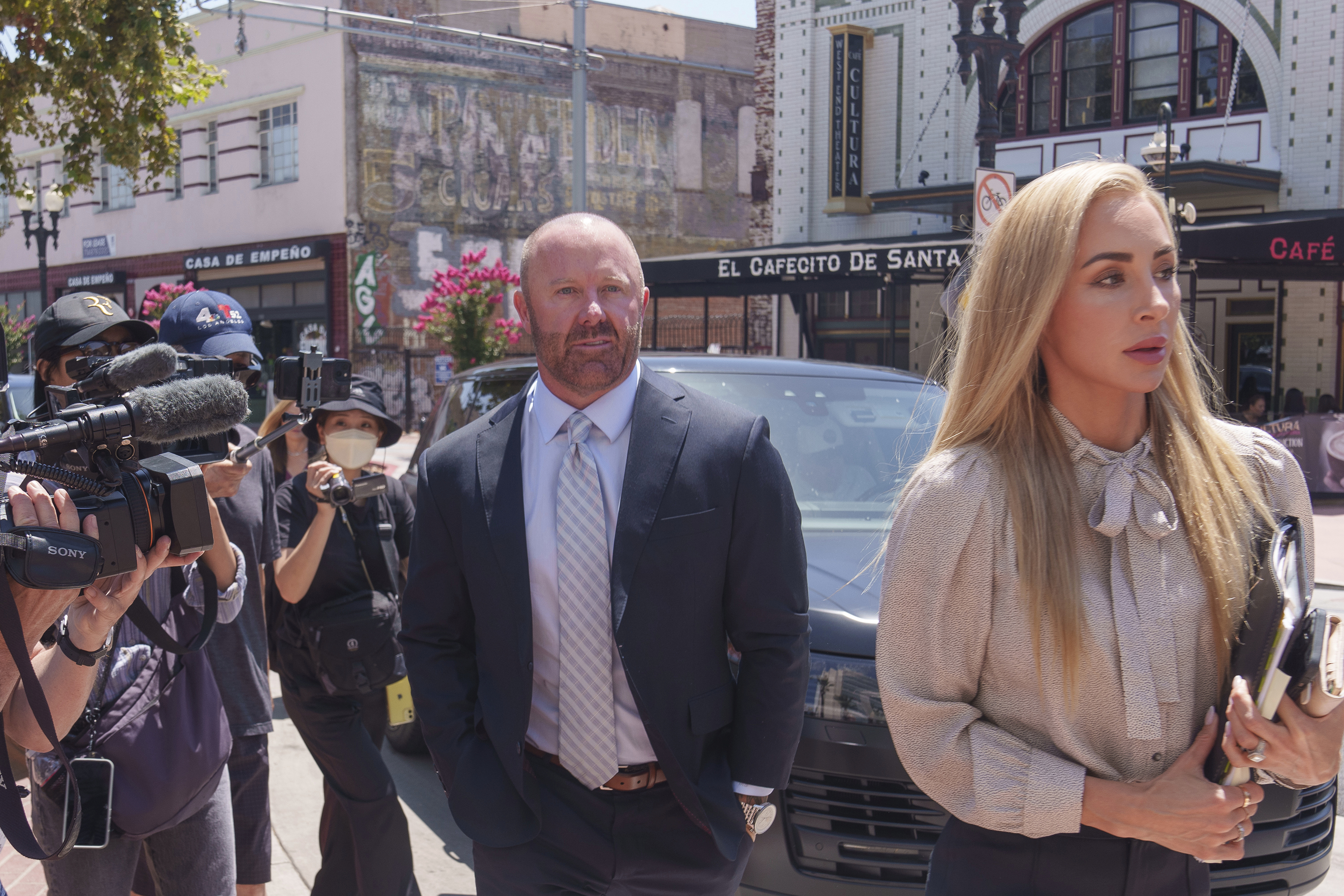 Mathew Bowyer, center, a Southern California bookmaker, arrives at federal court in Santa Ana, Calif., Friday, Aug. 9, 2024. 