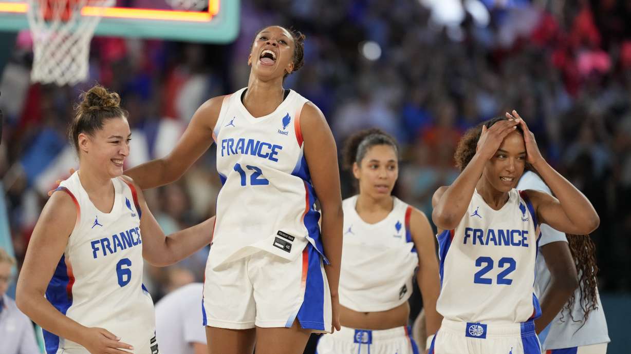 Alexia Chery (6), Iliana Rupert (12), and Marieme Badiane (22), of France, celebrate after France beat Belgium during a women's semifinal basketball game at Bercy Arena at the 2024 Summer Olympics, Friday, Aug. 9, 2024, in Paris, France.