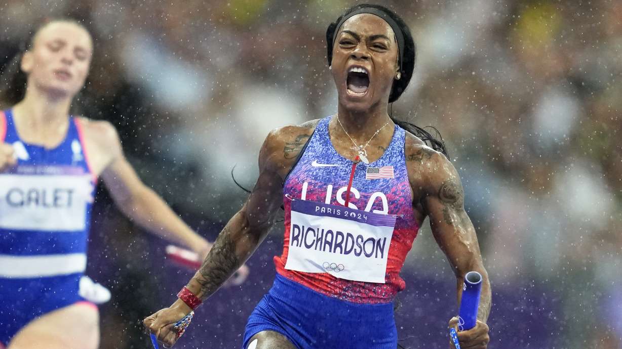 Sha'carri Richardson, of the United States, crosses the finish line to win the gold medal in the women's 4 x 100 meters relay final at the 2024 Summer Olympics, Friday, Aug. 9, 2024, in Saint-Denis, France.