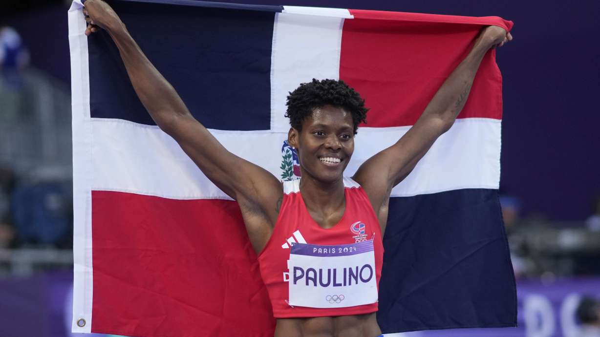 Marileidy Paulino, of the Dominican Republic, celebrates winning the women's 400-meter final at the 2024 Summer Olympics, Friday, Aug. 9, 2024, in Saint-Denis, France.