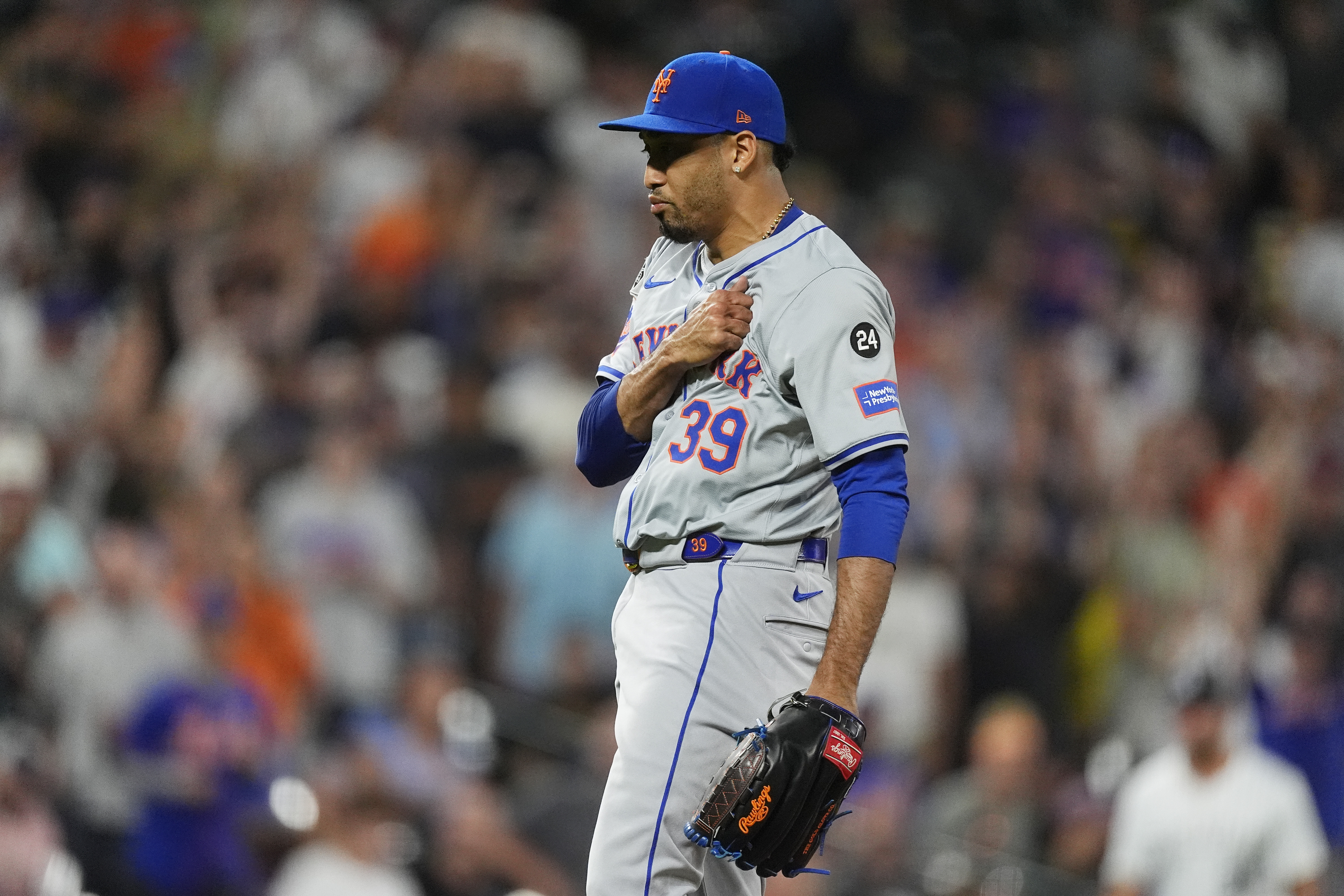 New York Mets pitcher Edwin Díaz reacts after striking out Colorado Rockies' Charlie Blackmon to end a baseball game Wednesday, Aug. 7, 2024, in Denver. 