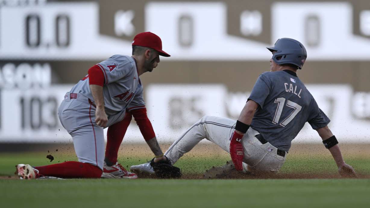 Los Angeles Angels shortstop Zach Neto, left, tags out Washington Nationals' Alex Call, right, who was attempting to steal second base during the first inning of a baseball game, Friday, Aug. 9, 2024, in Washington.