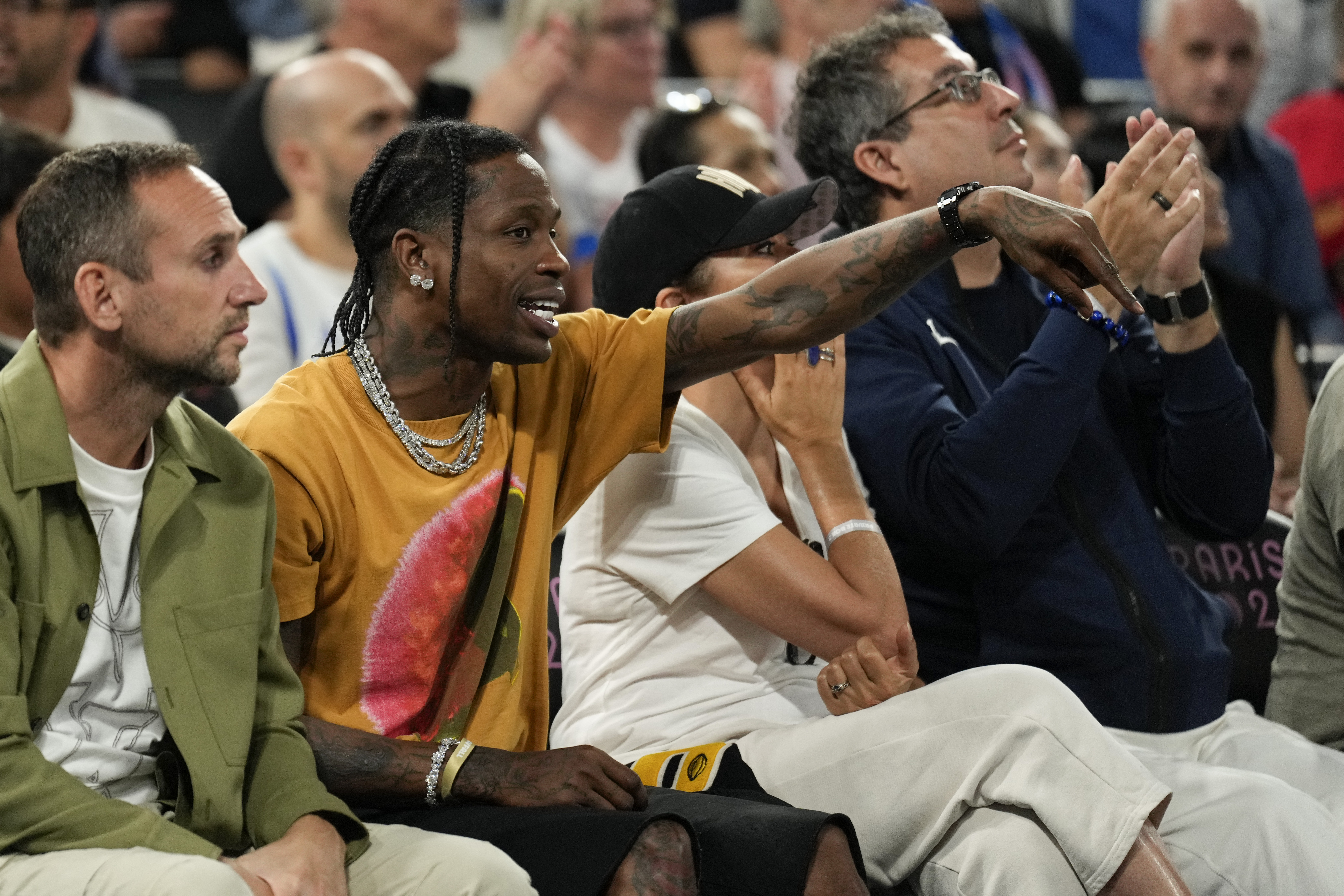 Travis Scott watches the France vs' Germany game during a men's semifinals basketball game at Bercy Arena at the 2024 Summer Olympics, Thursday, Aug. 8, 2024, in Paris, France.