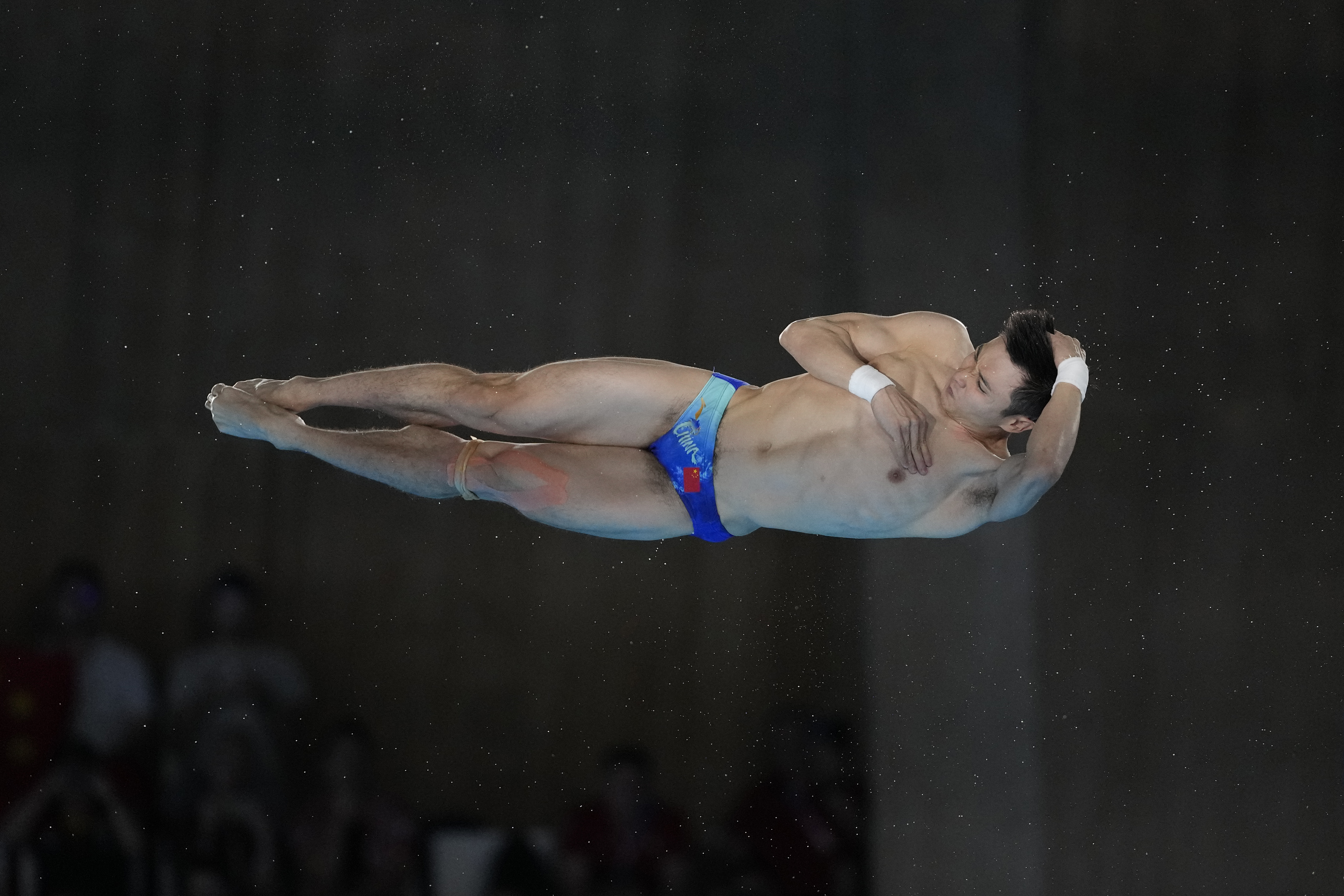 China's Cao Yuan competes in the men's 10m platform diving preliminary, at the 2024 Summer Olympics, Friday, Aug. 9, 2024, in Saint-Denis, France. 