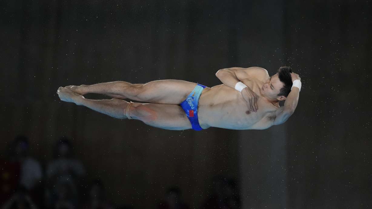China's Cao Yuan competes in the men's 10m platform diving preliminary, at the 2024 Summer Olympics, Friday, Aug. 9, 2024, in Saint-Denis, France.