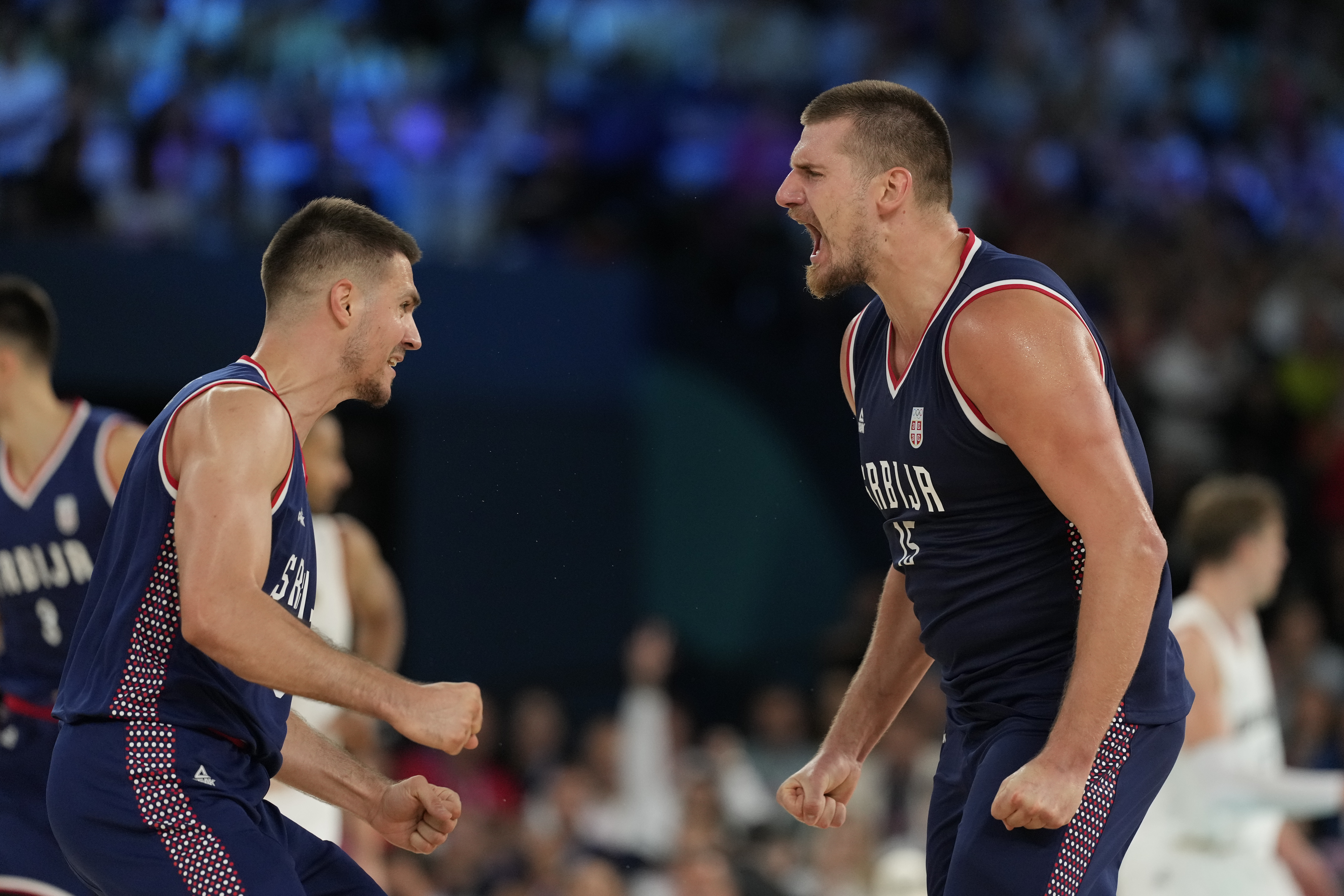 Nikola Jokic (15), of Serbia celebrates a basket against Germany during a men's bronze medal basketball game at Bercy Arena at the 2024 Summer Olympics, Saturday, Aug. 10, 2024, in Paris, France. 