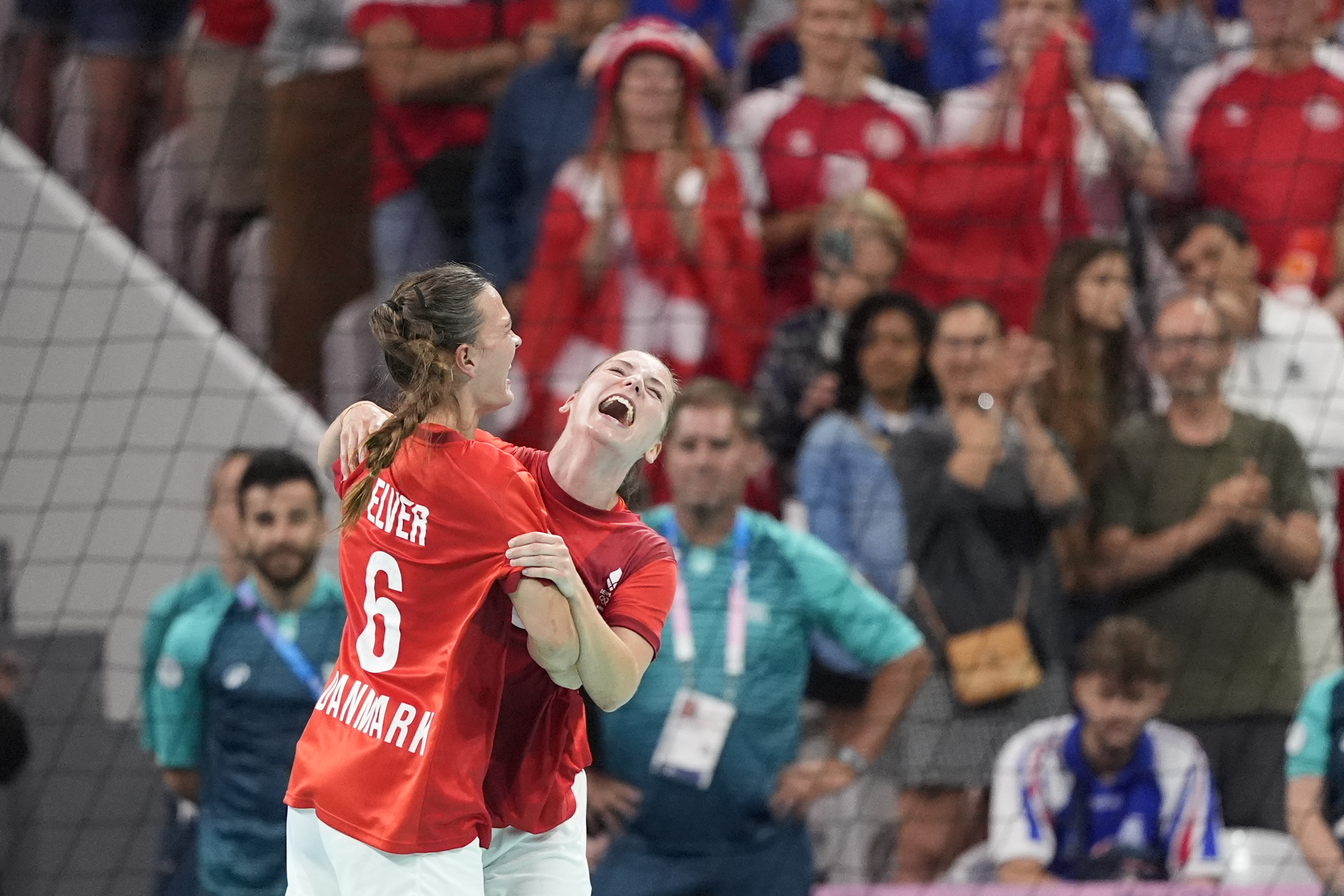 Denmark's Mie Hoejlund, right, and Denmark's Helena Elver celebrate their victory after the bronze medal handball match between Denmark and Sweden at the 2024 Summer Olympics, Saturday, Aug. 10, 2024, in Villeneuve-d'Ascq, France. 