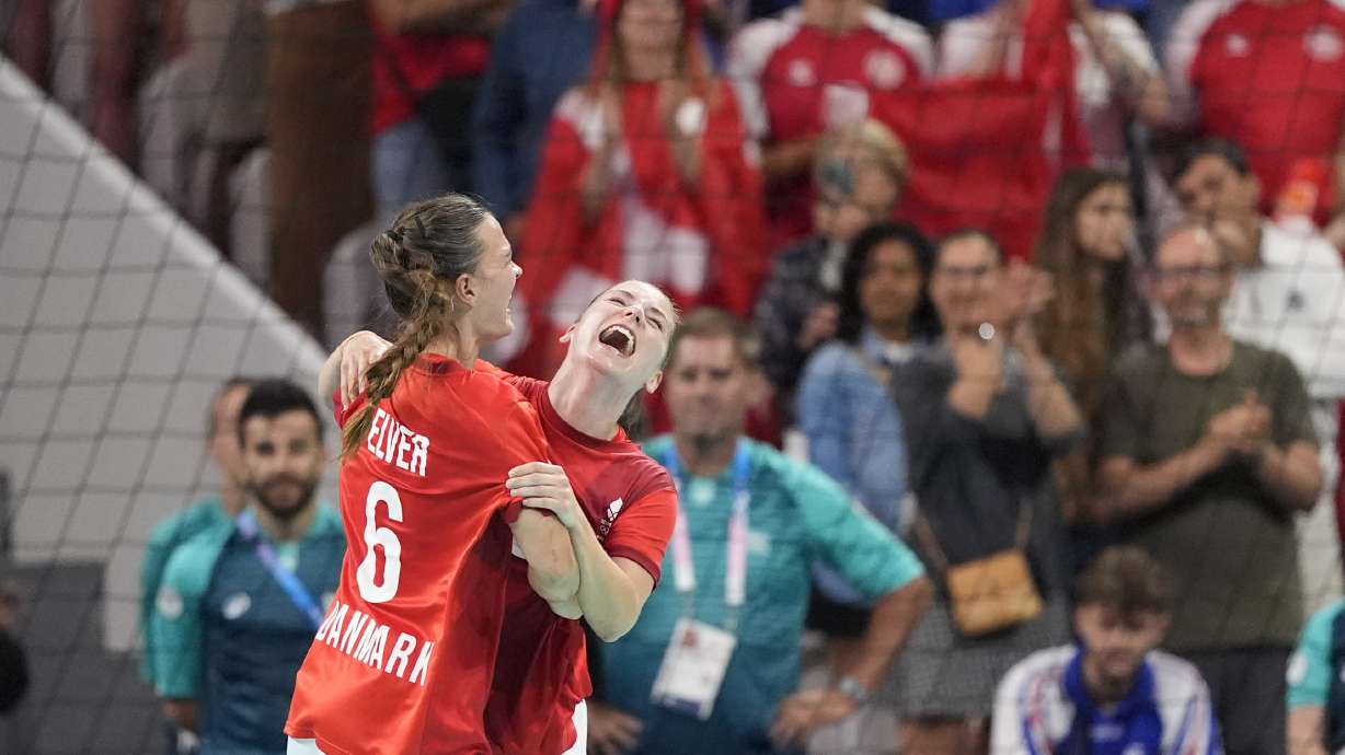 Denmark's Mie Hoejlund, right, and Denmark's Helena Elver celebrate their victory after the bronze medal handball match between Denmark and Sweden at the 2024 Summer Olympics, Saturday, Aug. 10, 2024, in Villeneuve-d'Ascq, France.