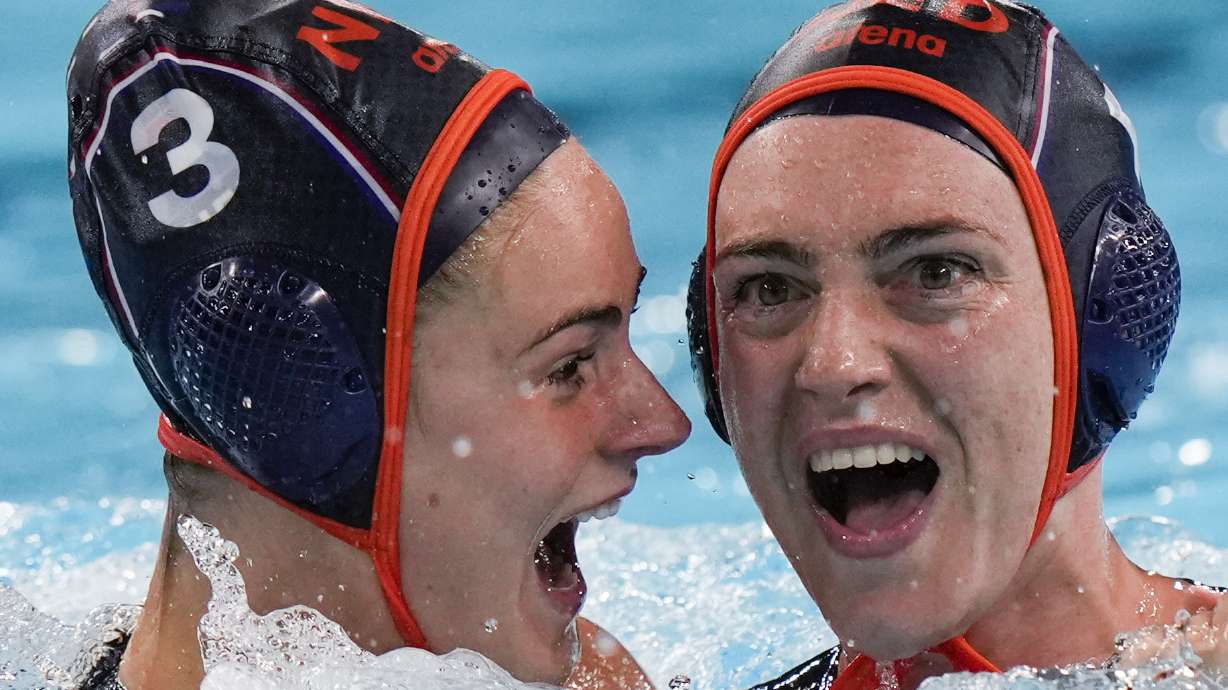 Netherland's Sabrina Van Der Sloot, right, celebrates with teammate Brigitte Sleeking after scoring against United States during the women's bronze medal water polo match at the 2024 Summer Olympics, Saturday, Aug. 10, 2024, in Paris, France.
