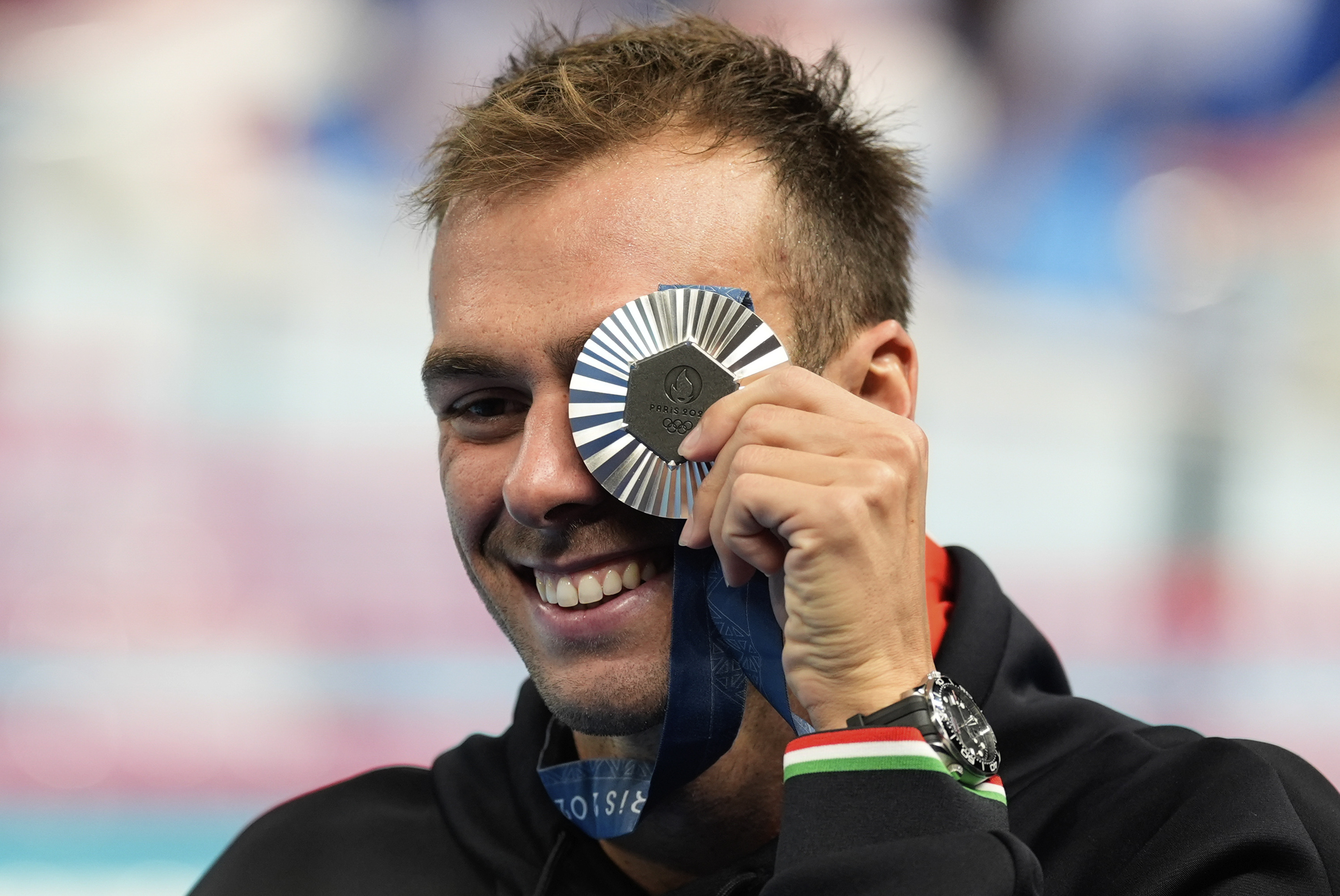 Italy's Gregorio Paltrinieri poses for a photo with his silver medal during the awards ceremony for the men's 1500-meter freestyle at the Summer Olympics in Nanterre, France, Sunday, Aug. 4, 2024. 