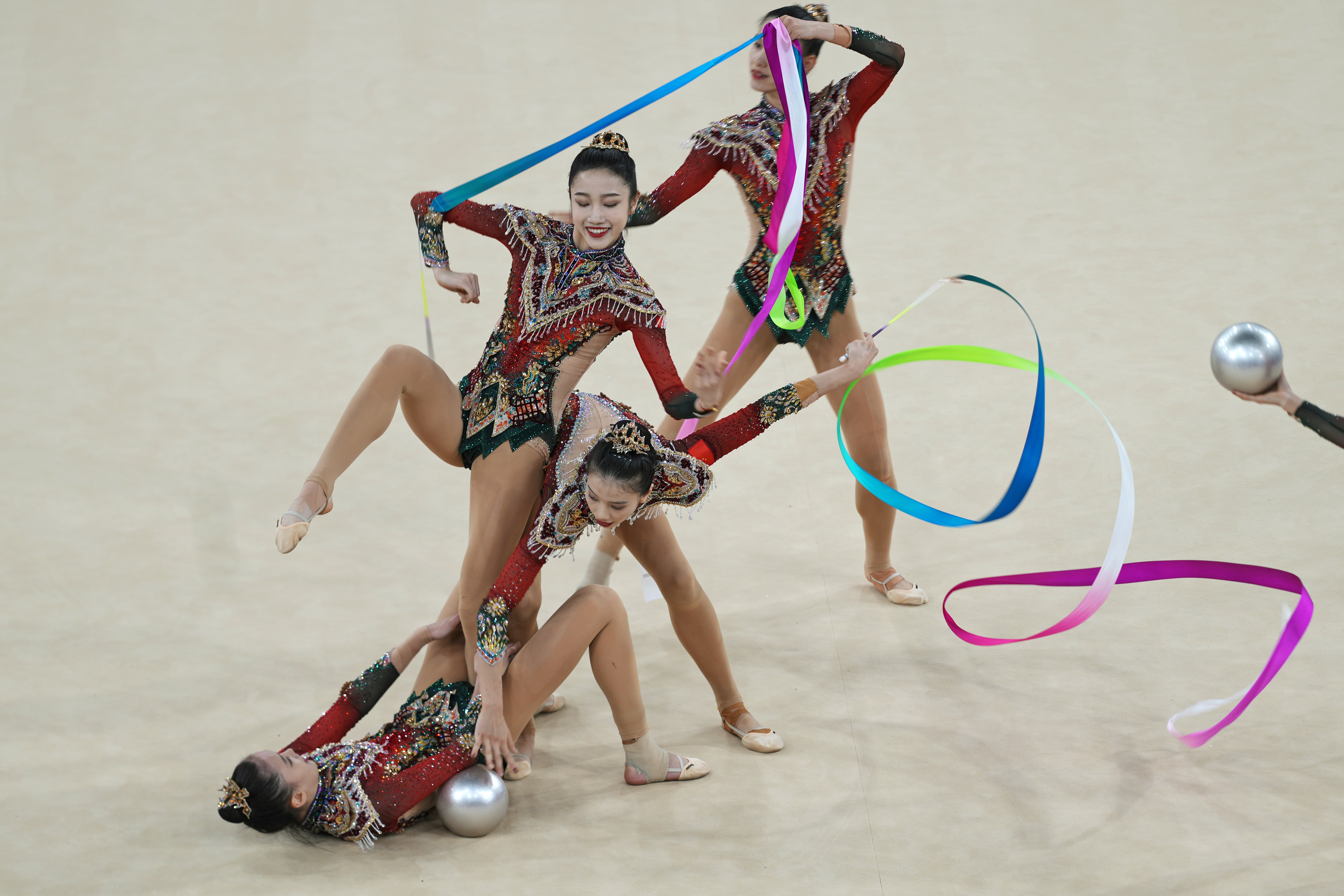 Team China performs with ribbons and balls in the group all-around rhythmic gymnastics final at La Chapelle Arena during the 2024 Summer Olympics, Saturday, Aug. 10, 2024, in Paris, France. 