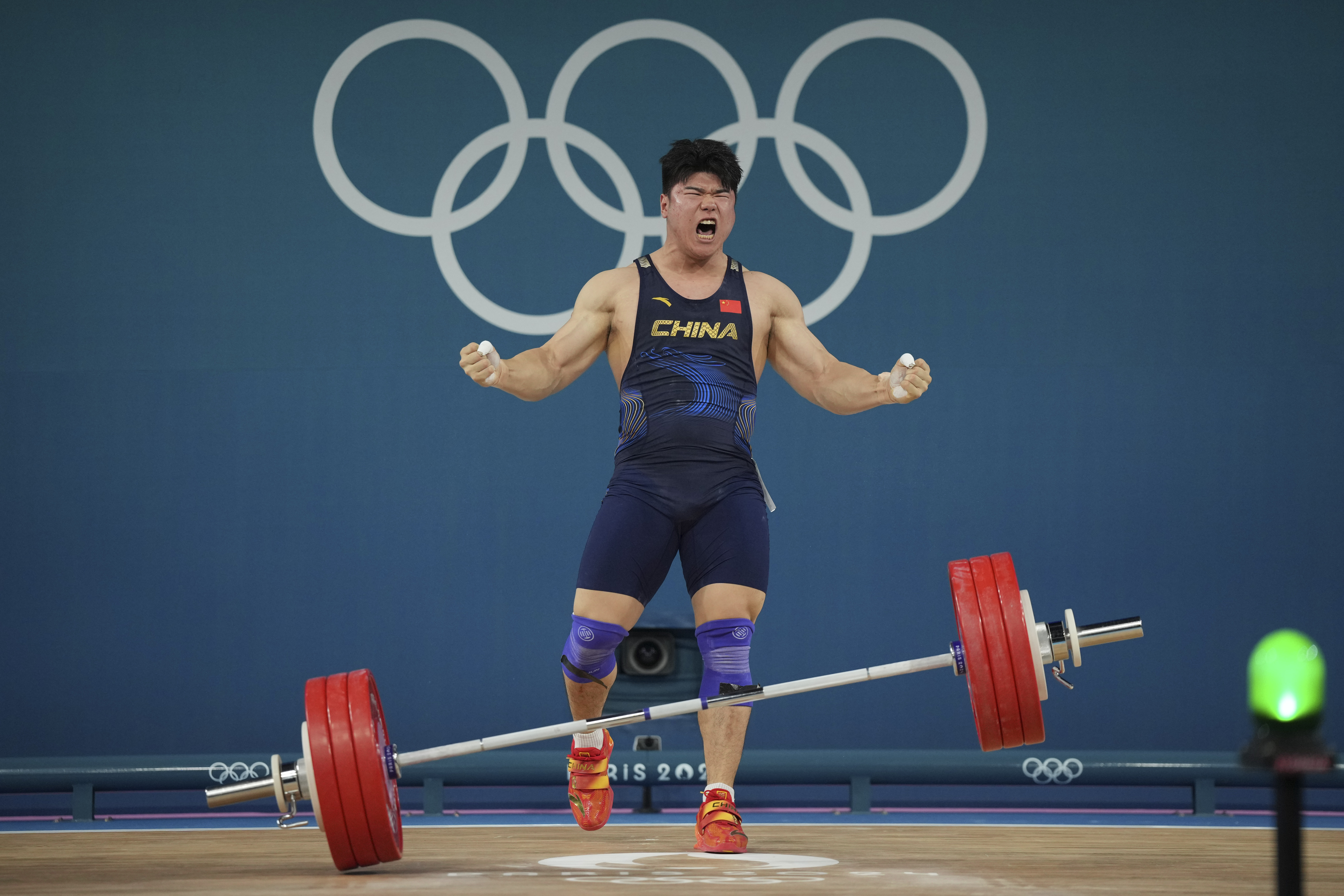 Liu Huanhua of China reacts after a good lift during the men's 102kg weightlifting event, at the 2024 Summer Olympics, Saturday, Aug. 10, 2024, in Paris, France. 