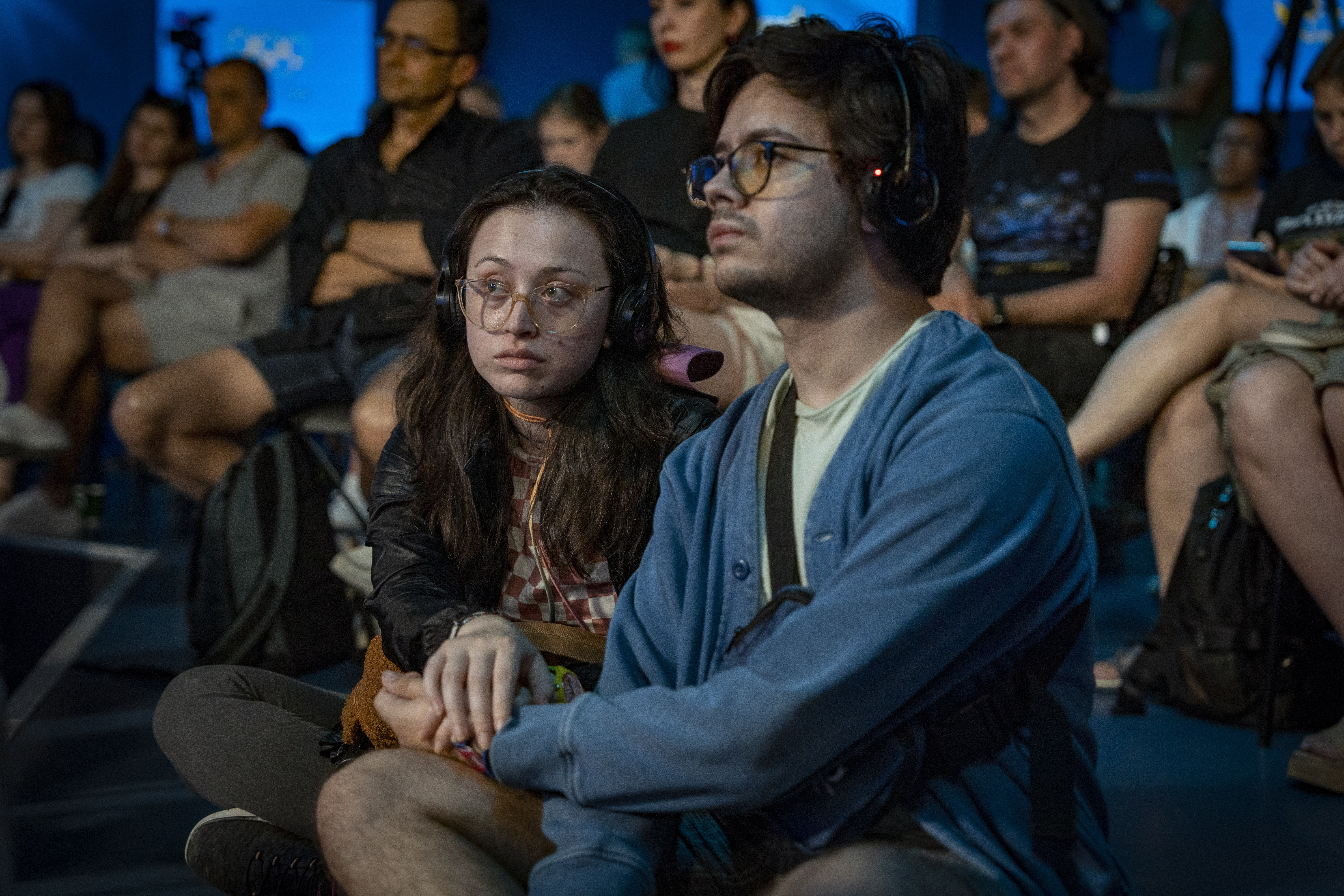 People listen to a public talk at the Ukrainian House in Paris, France, Sunday, Aug. 4, 2024. 