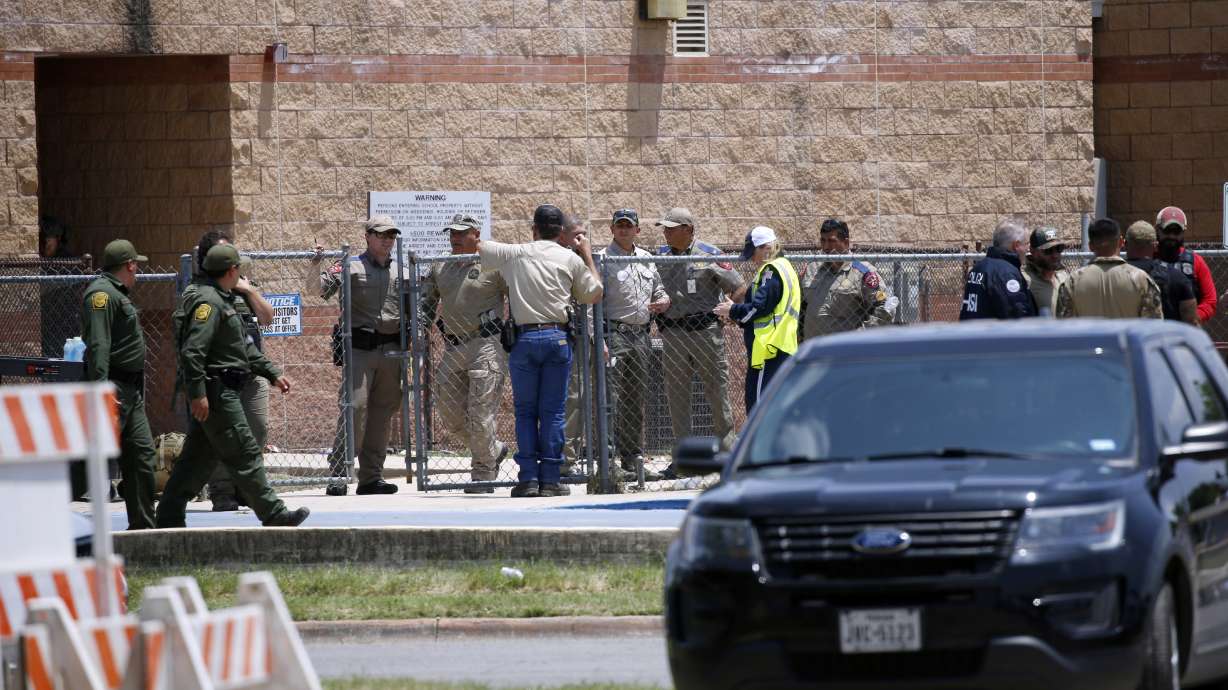 Law enforcement and other first responders gather outside Robb Elementary School following a shooting, May 24, 2022, in Uvalde, Texas.
