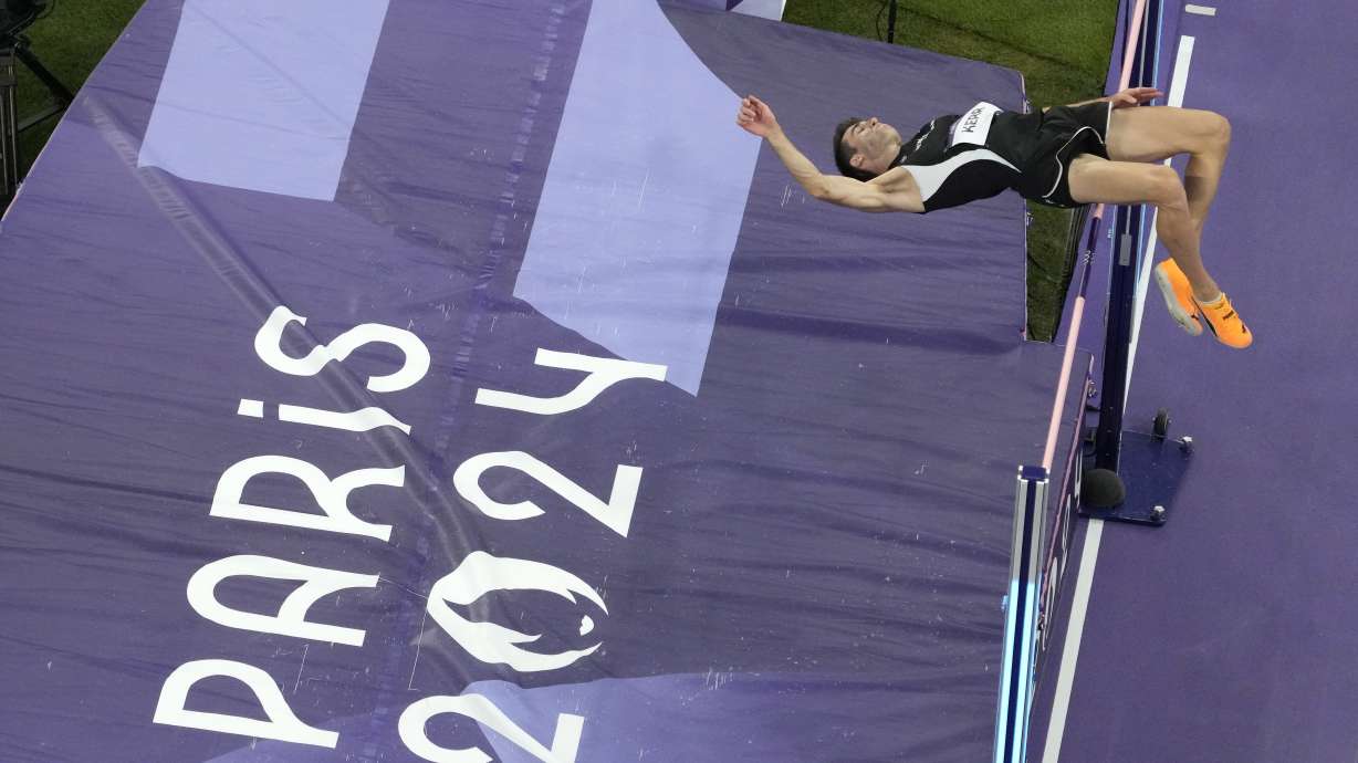 Hamish Kerr, of New Zealand, clears the bar to win the men's high jump final at the 2024 Summer Olympics, Saturday, Aug. 10, 2024, in Saint-Denis, France.