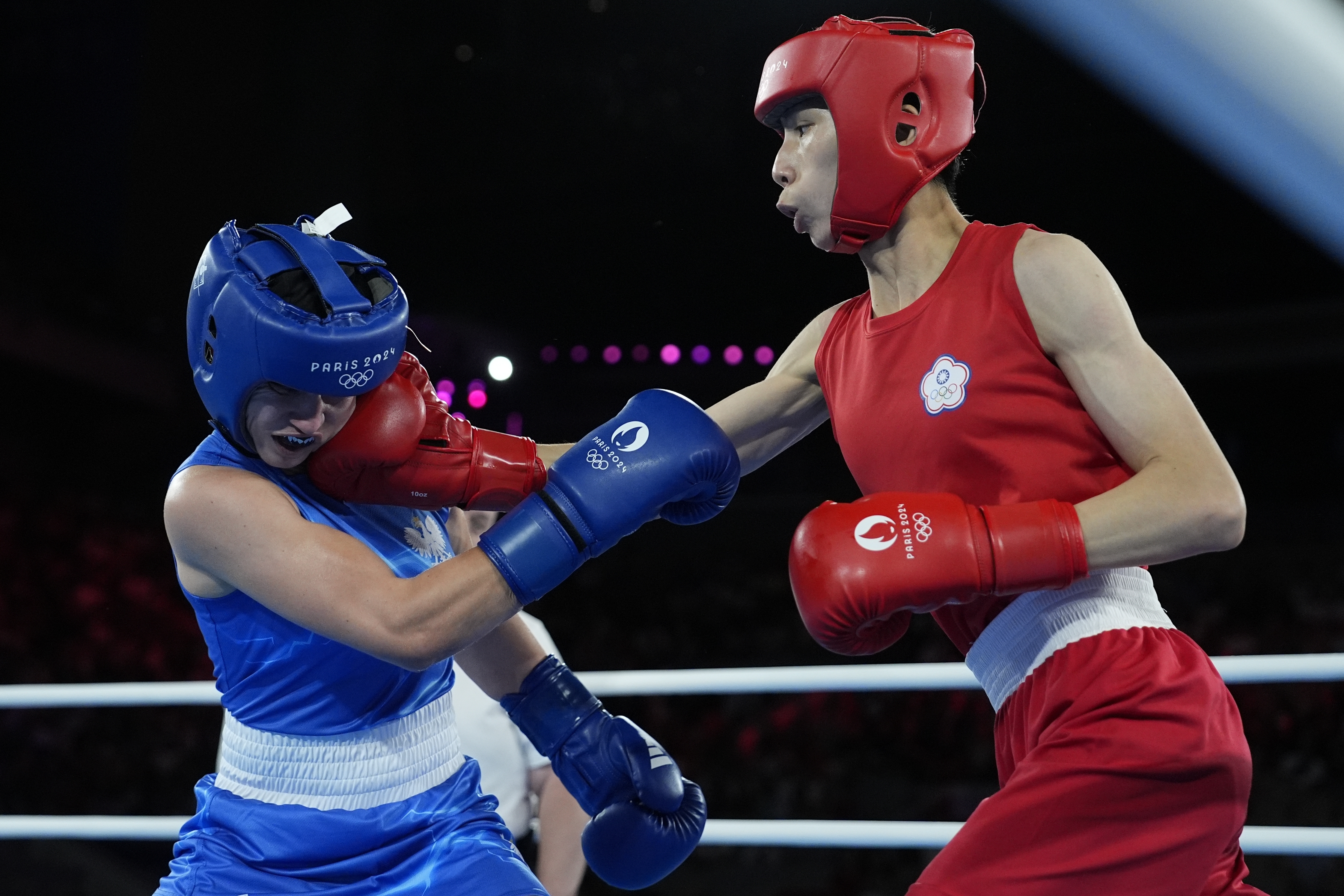 Taiwan's Lin Yu-ting, right, fights Poland's Julia Szeremeta in their women's 57 kg final boxing match at the 2024 Summer Olympics, Saturday, Aug. 10, 2024, in Paris, France. 
