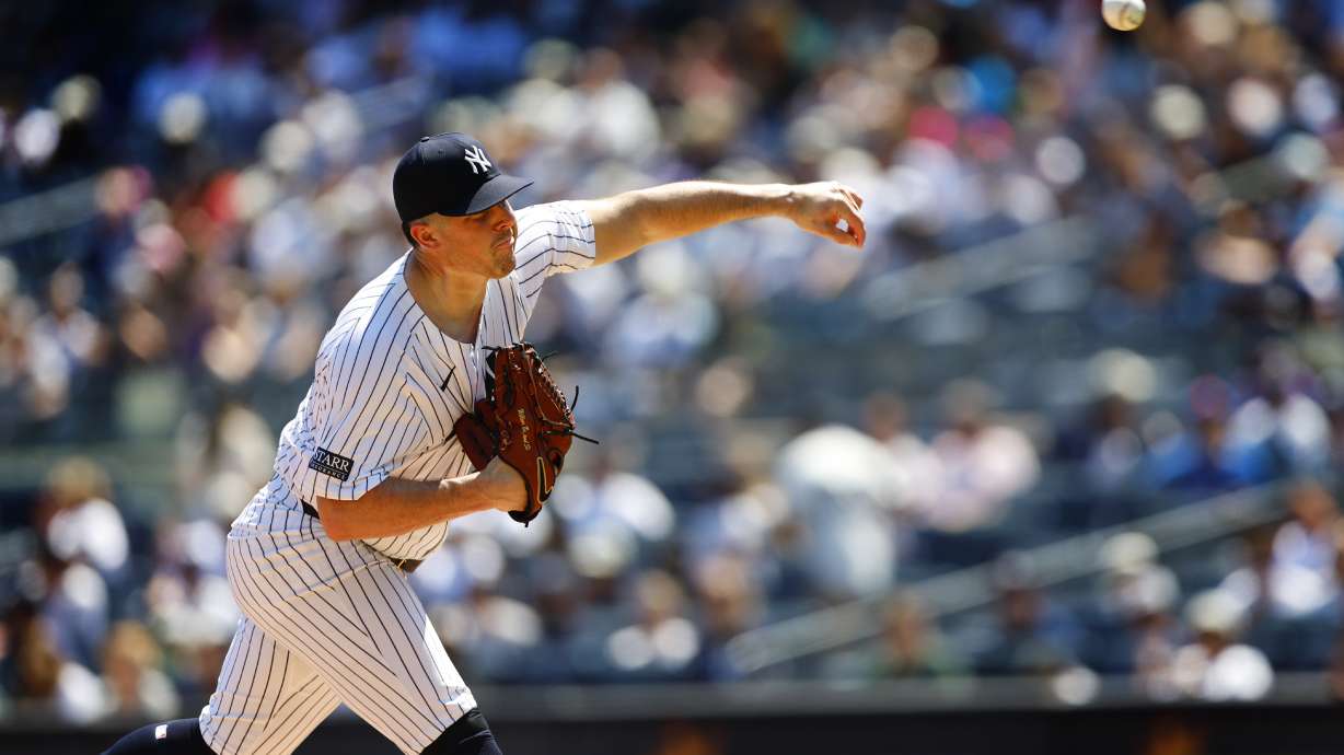 New York Yankees' Carlos Rodón pitches against the Texas Rangers during the first inning of the first game of a baseball double header, Saturday, Aug. 10, 2024, in New York.