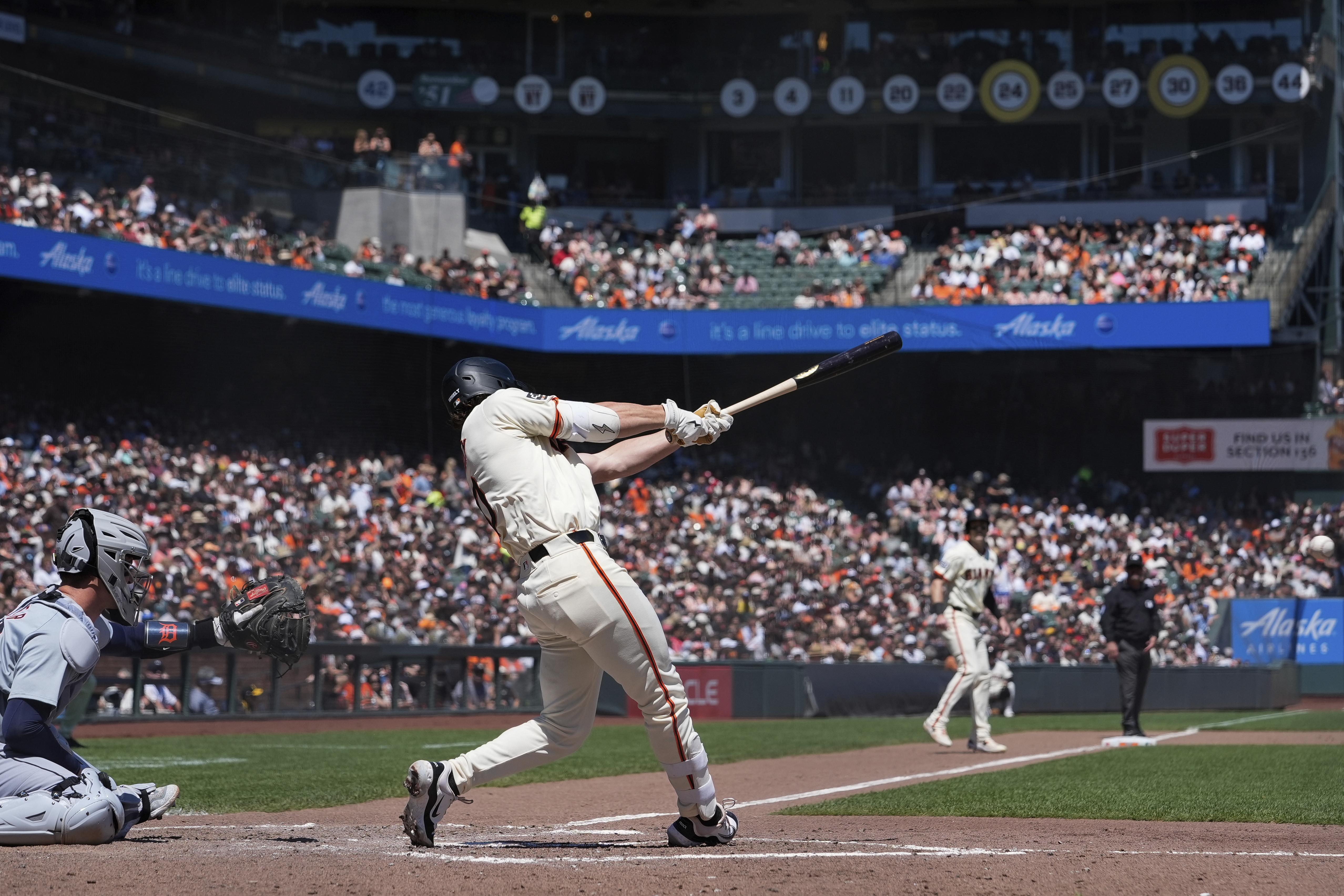 San Francisco Giants' Brett Wisely, center, hits a two-run double Detroit Tigers during the fifth inning of a baseball game Saturday, Aug. 10, 2024, in San Francisco. 